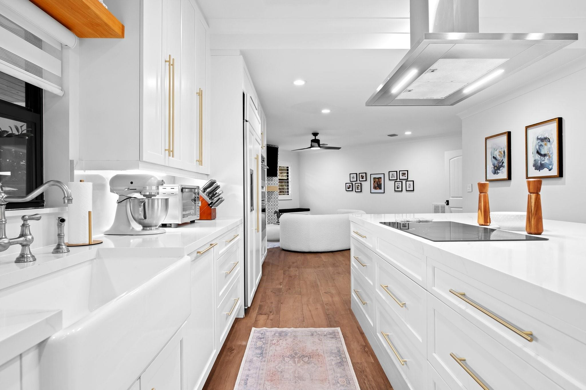 5751 Plantation Road Plantation, FL 33317 - Photo 12 of 32 a large white kitchen with a large window