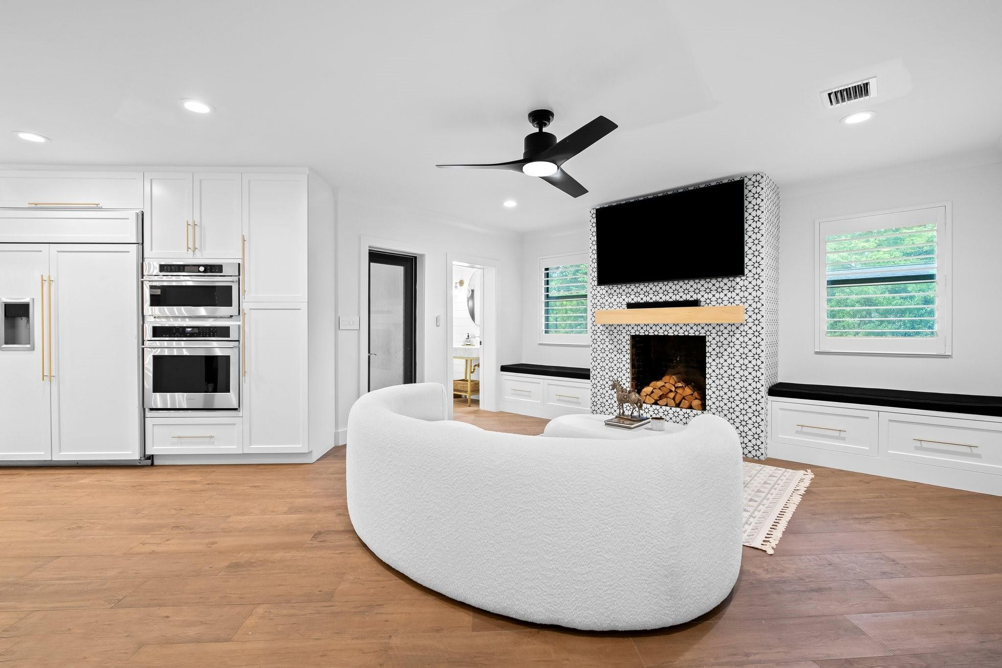 5751 Plantation Road Plantation, FL 33317 - Photo 13 of 32 a living room with fireplace furniture and a flat screen tv
