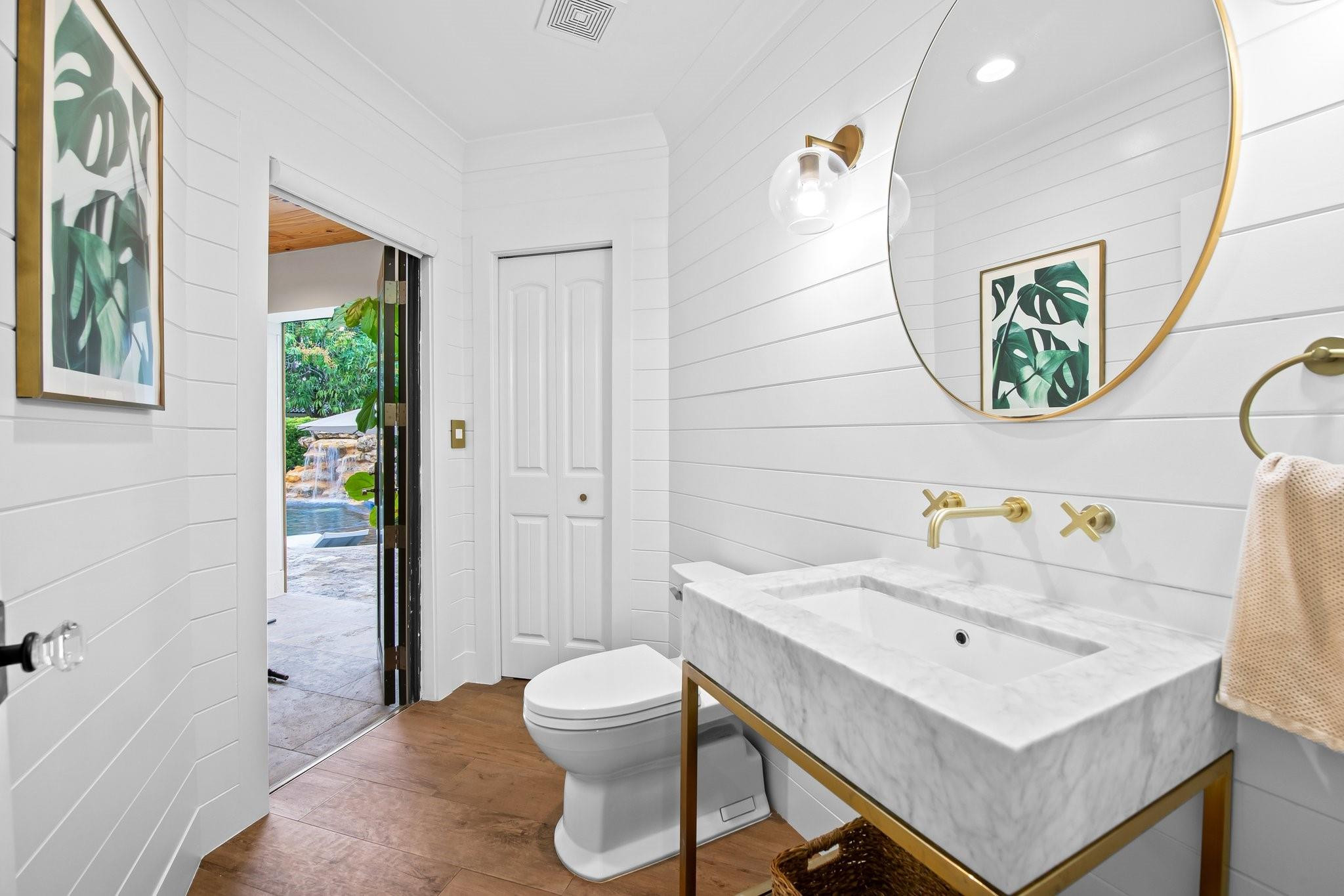 5751 Plantation Road Plantation, FL 33317 - Photo 14 of 32 a bathroom with a sink a toilet and shower