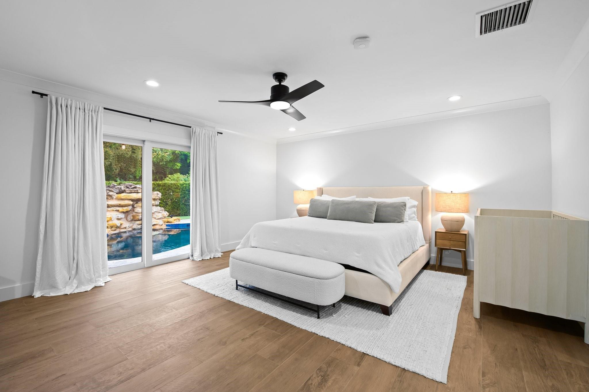 5751 Plantation Road Plantation, FL 33317 - Photo 15 of 32 a spacious bedroom with a bed and large window
