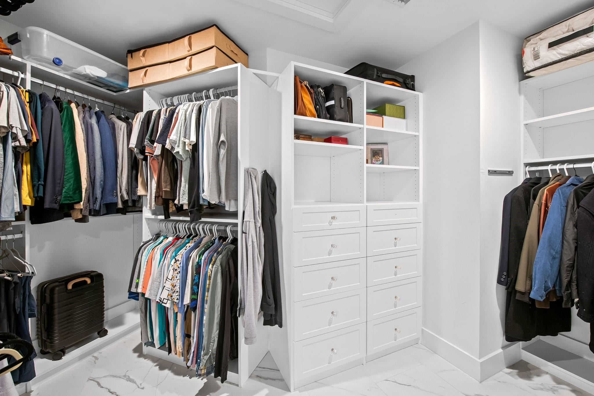 5751 Plantation Road Plantation, FL 33317 - Photo 19 of 32 a view of walk in closet with clothes and shoes