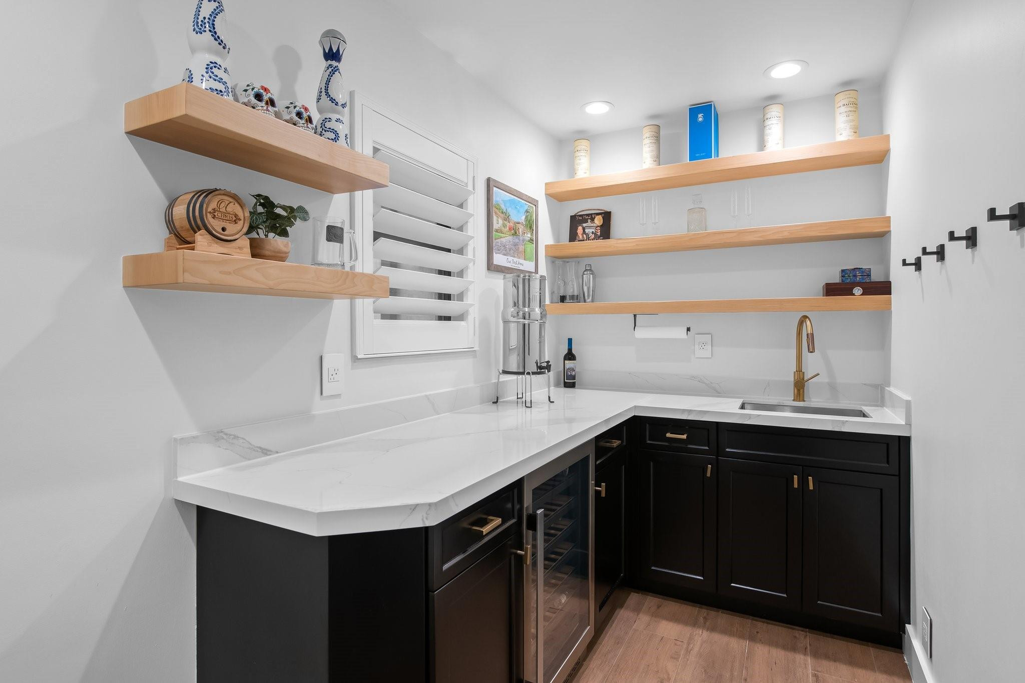 5751 Plantation Road Plantation, FL 33317 - Photo 23 of 32 a kitchen with a sink a stove and cabinets