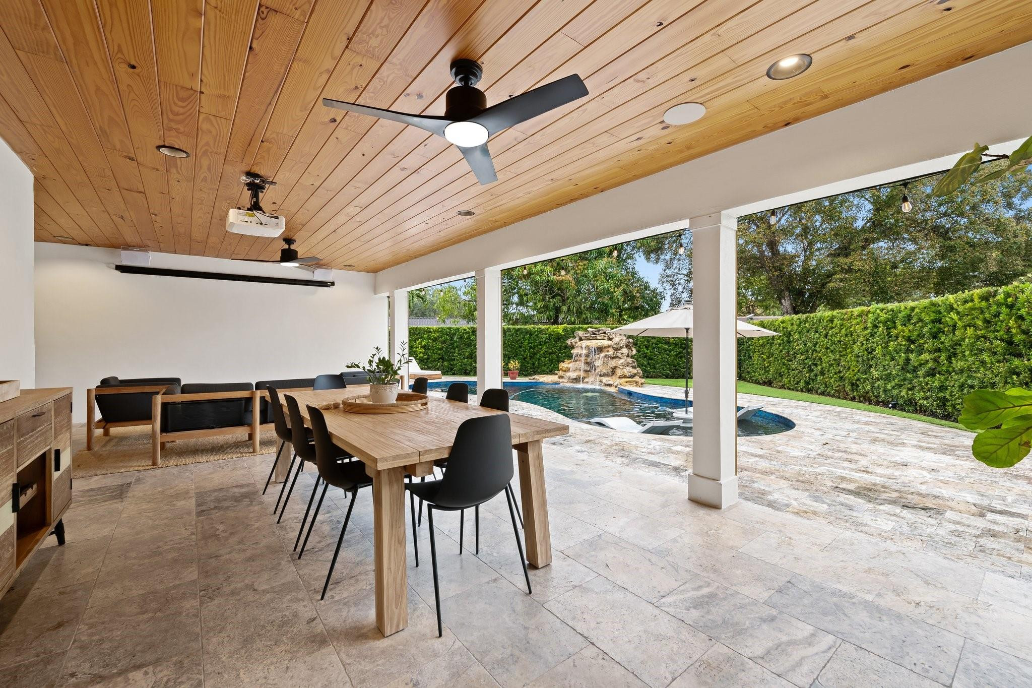 5751 Plantation Road Plantation, FL 33317 - Photo 26 of 32 a patio with a table and chairs and a barbeque