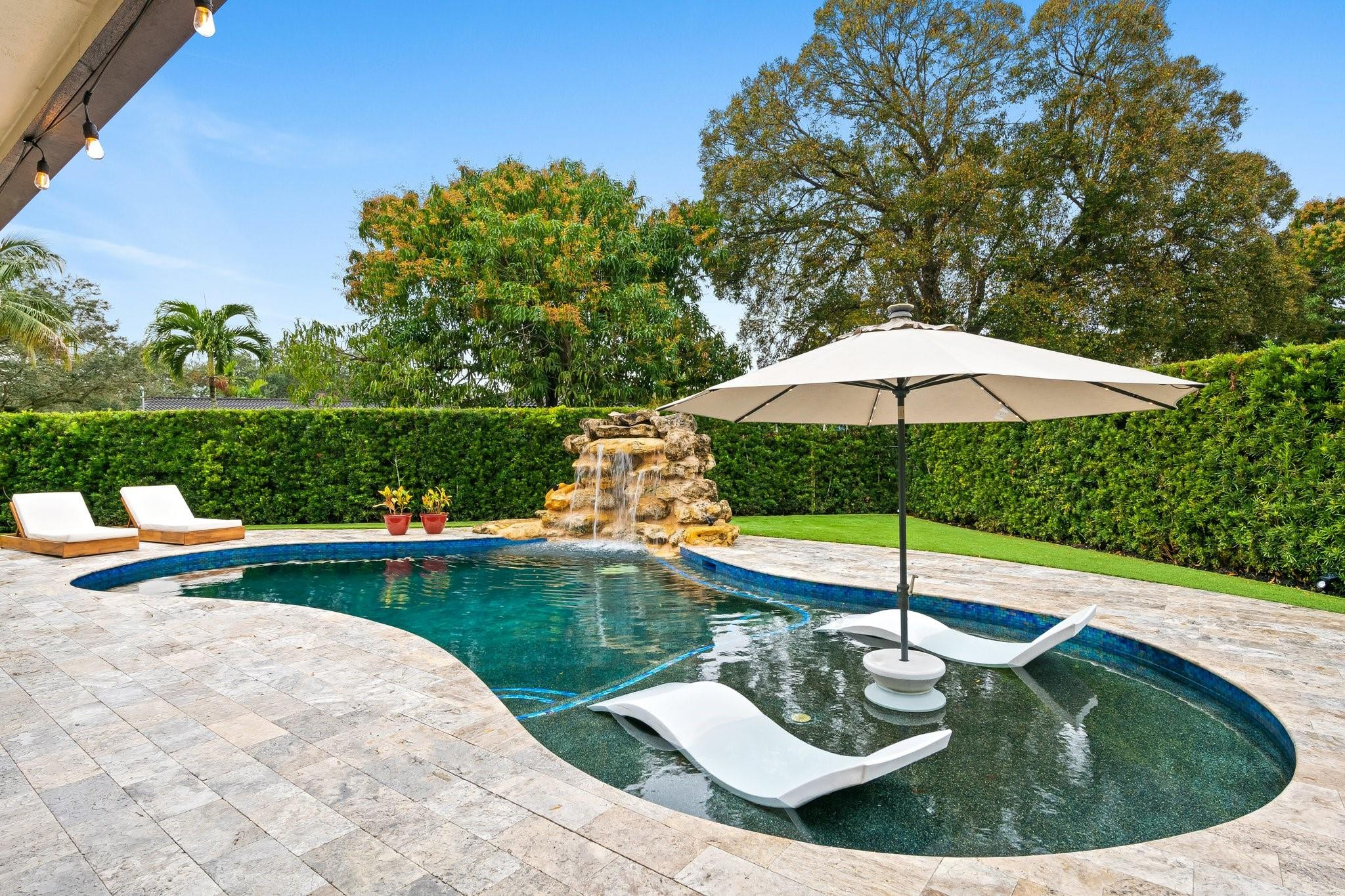5751 Plantation Road Plantation, FL 33317 - Photo 28 of 32 a view of a swimming pool with a patio