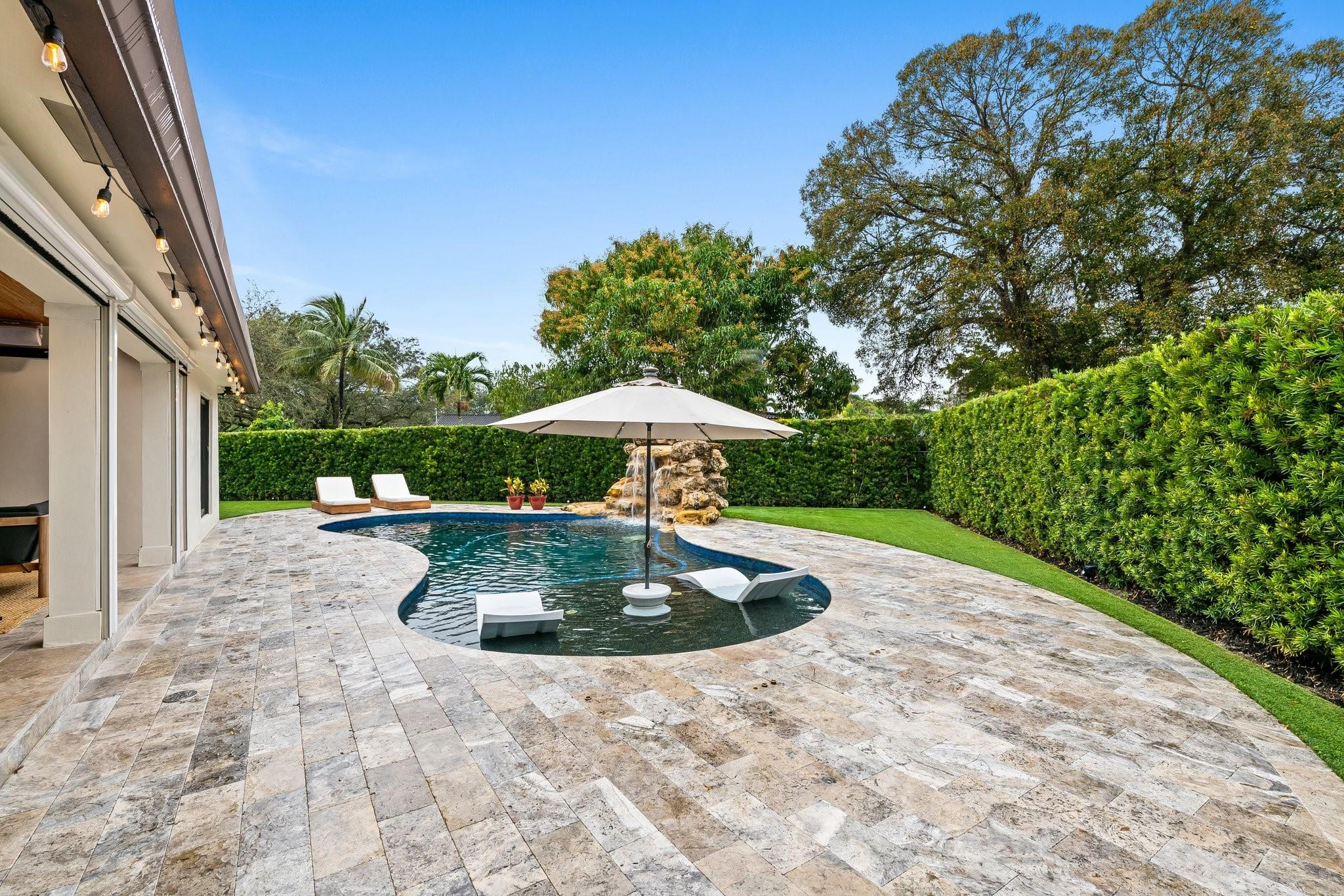 5751 Plantation Road Plantation, FL 33317 - Photo 29 of 32 a backyard of a house with lots of green space