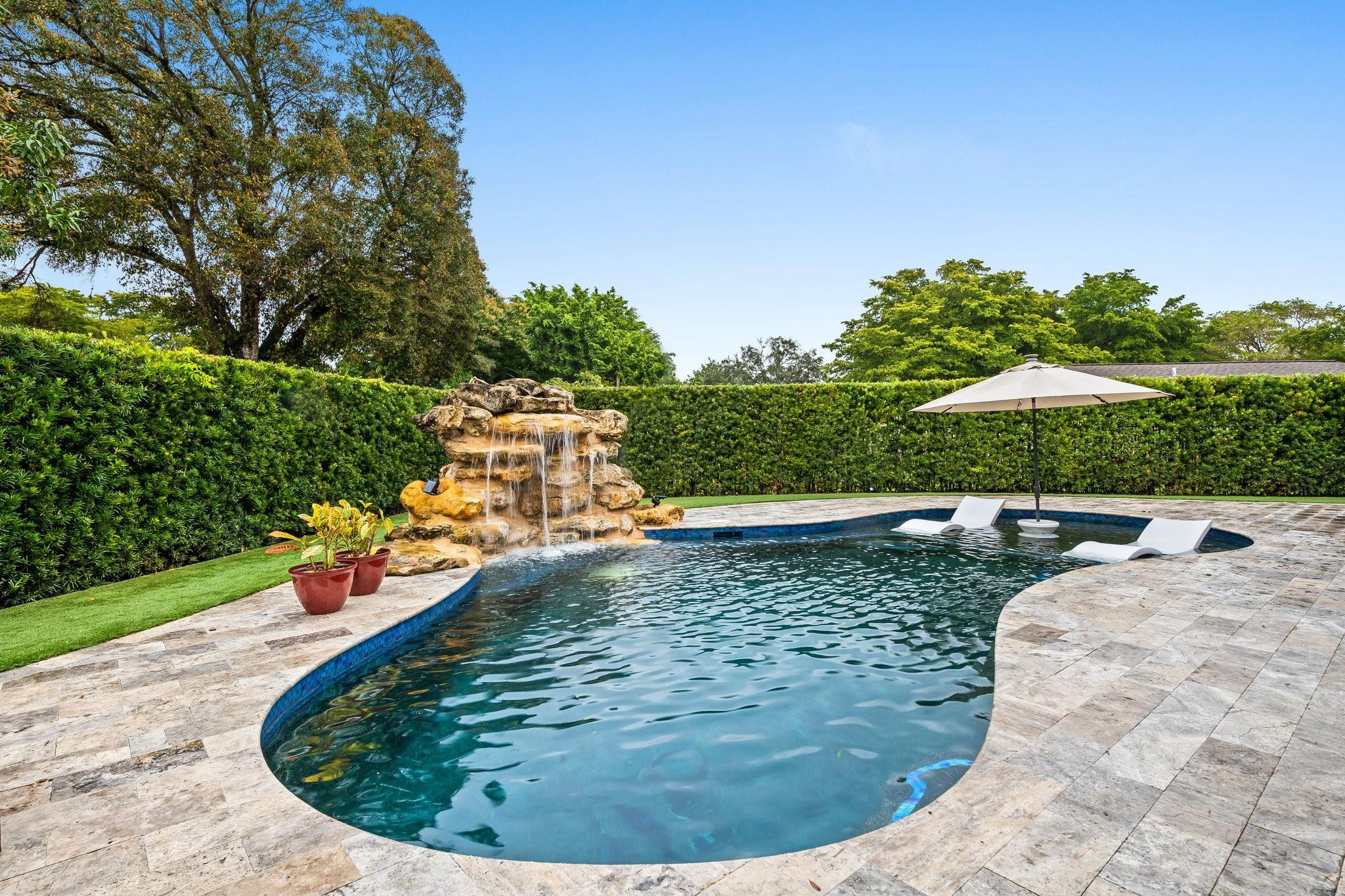 5751 Plantation Road Plantation, FL 33317 - Photo 30 of 32 a view of a swimming pool with a yard