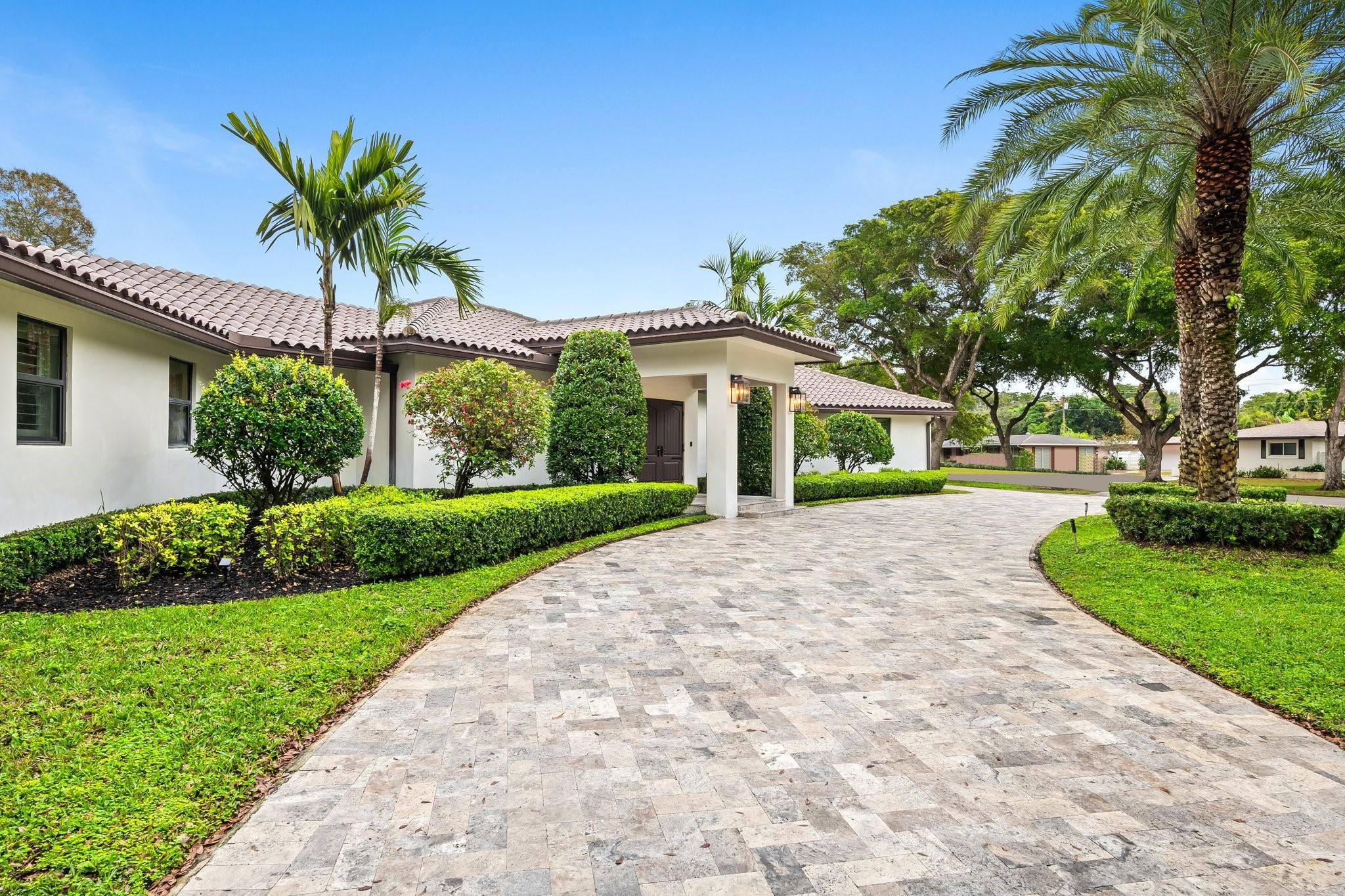 5751 Plantation Road Plantation, FL 33317 - Photo 3 of 32 a house with a yard and a palm tree