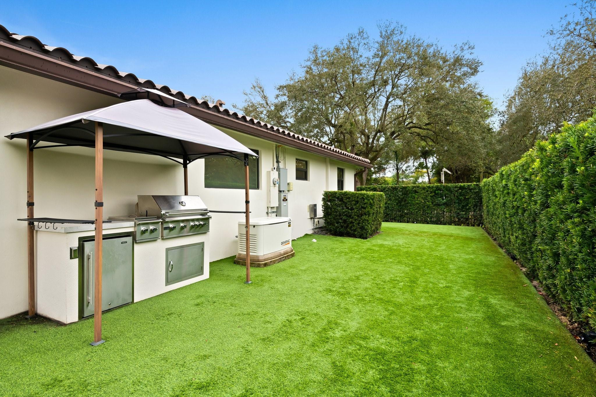 5751 Plantation Road Plantation, FL 33317 - Photo 31 of 32 a view of a porch with a yard fire pit and furniture