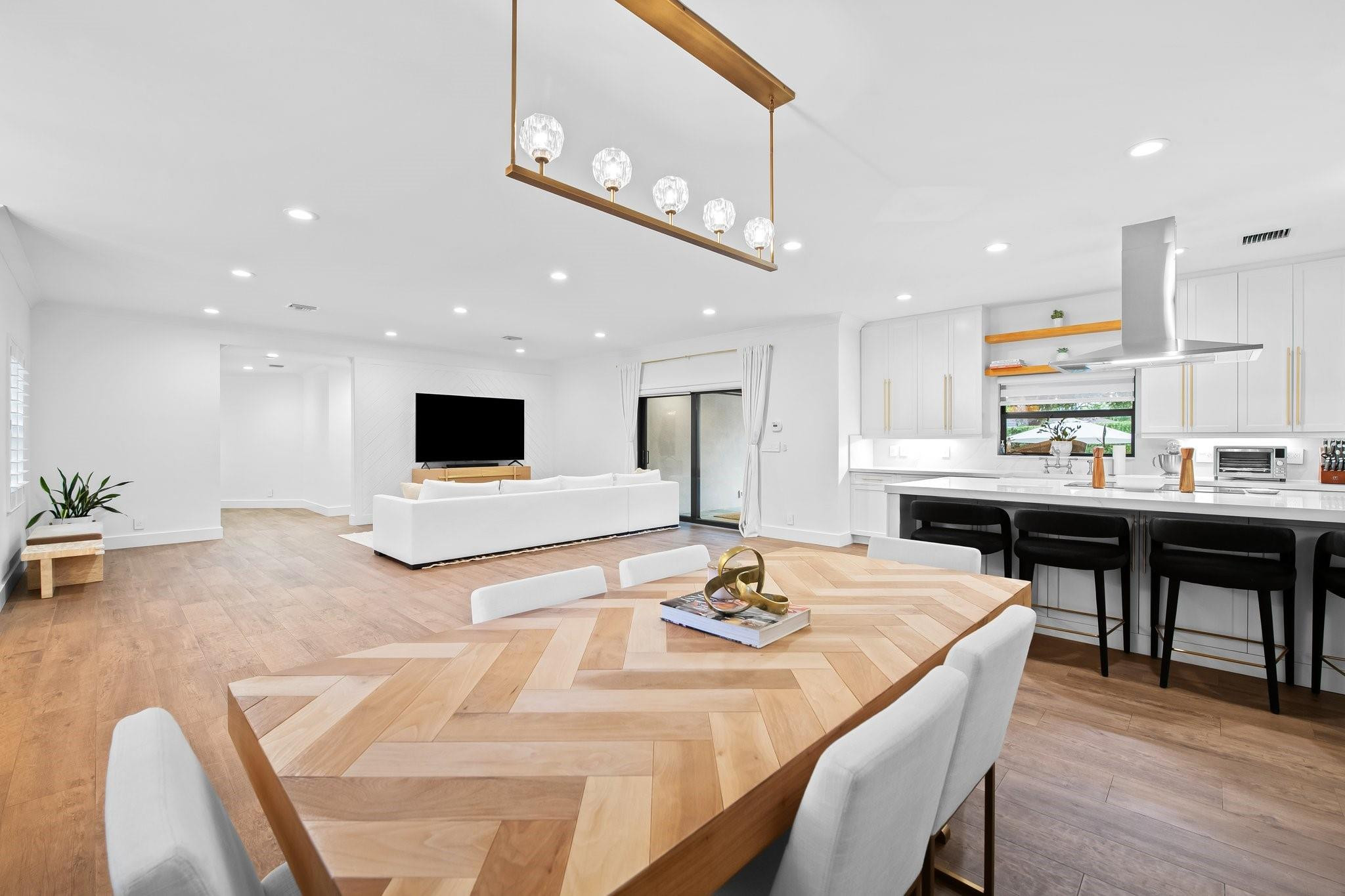 5751 Plantation Road Plantation, FL 33317 - Photo 9 of 32 a kitchen with stainless steel appliances kitchen island granite countertop a sink and cabinets