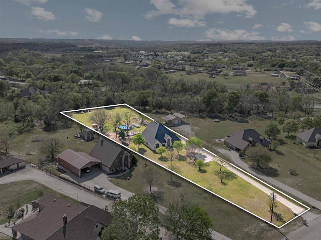 112 Waterfall Court Azle, TX 76020 - Photo 2 of 40 1.6 acres in a non-HOA community -- allowed to have horse and-or chickens, comes with a custom playhouse, pool and a small workshop along w a 5 bedroom house w a gameroom and study! Got it alllll!