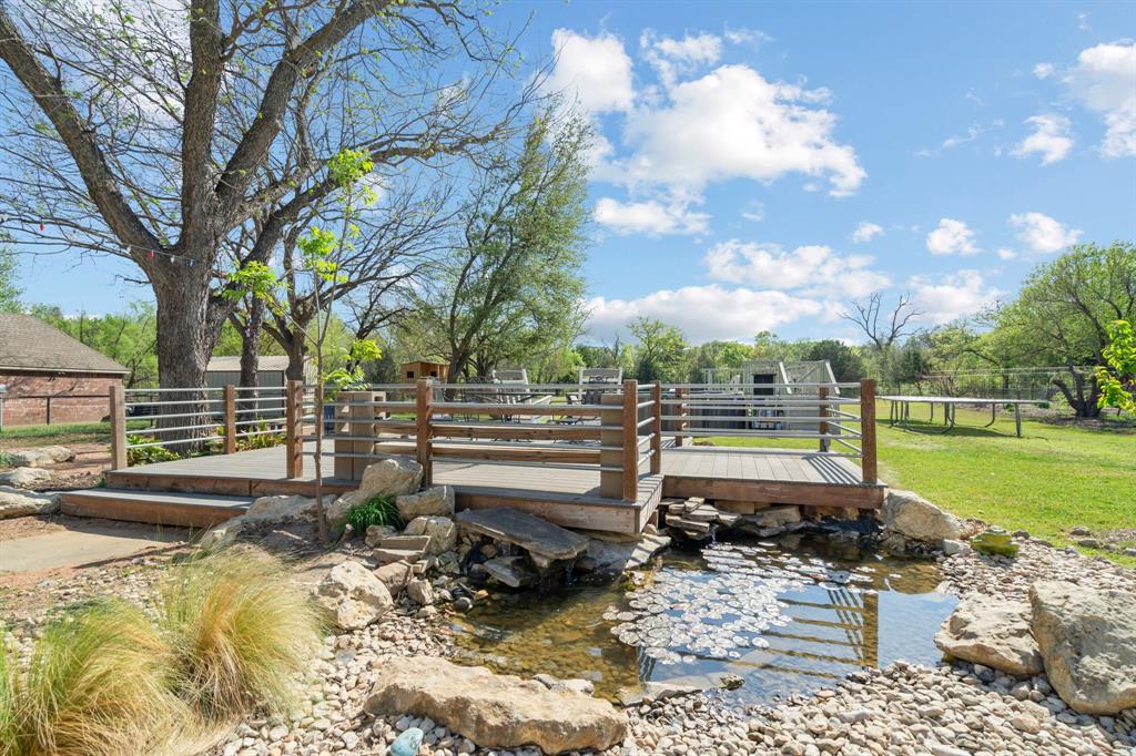 112 Waterfall Court Azle, TX 76020 - Photo 32 of 40 Koi pond with waterfall.
