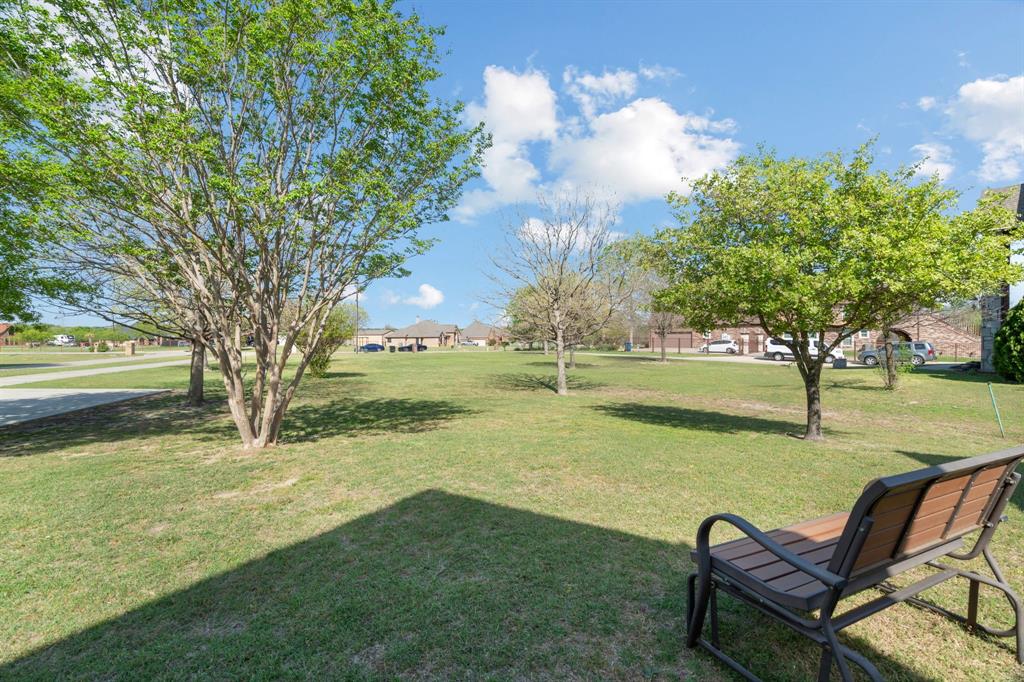 112 Waterfall Court Azle, TX 76020 - Photo 5 of 40 House sits back off the quiet dead end road...Plenty of front yard to sit and enjoy peaceful North eastern skies...