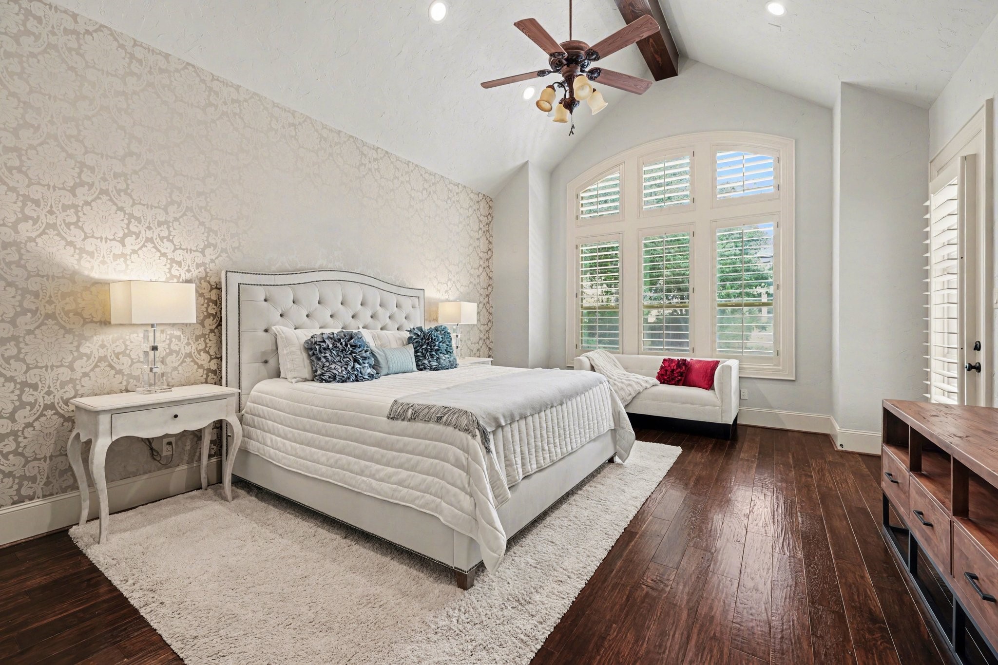 3 Player Ridge Court The Woodlands, TX 77382 - Photo 17 of 50 Secluded primary bedroom with vaulted ceilings, large windows, abundant natural light, and access to the backyard.
