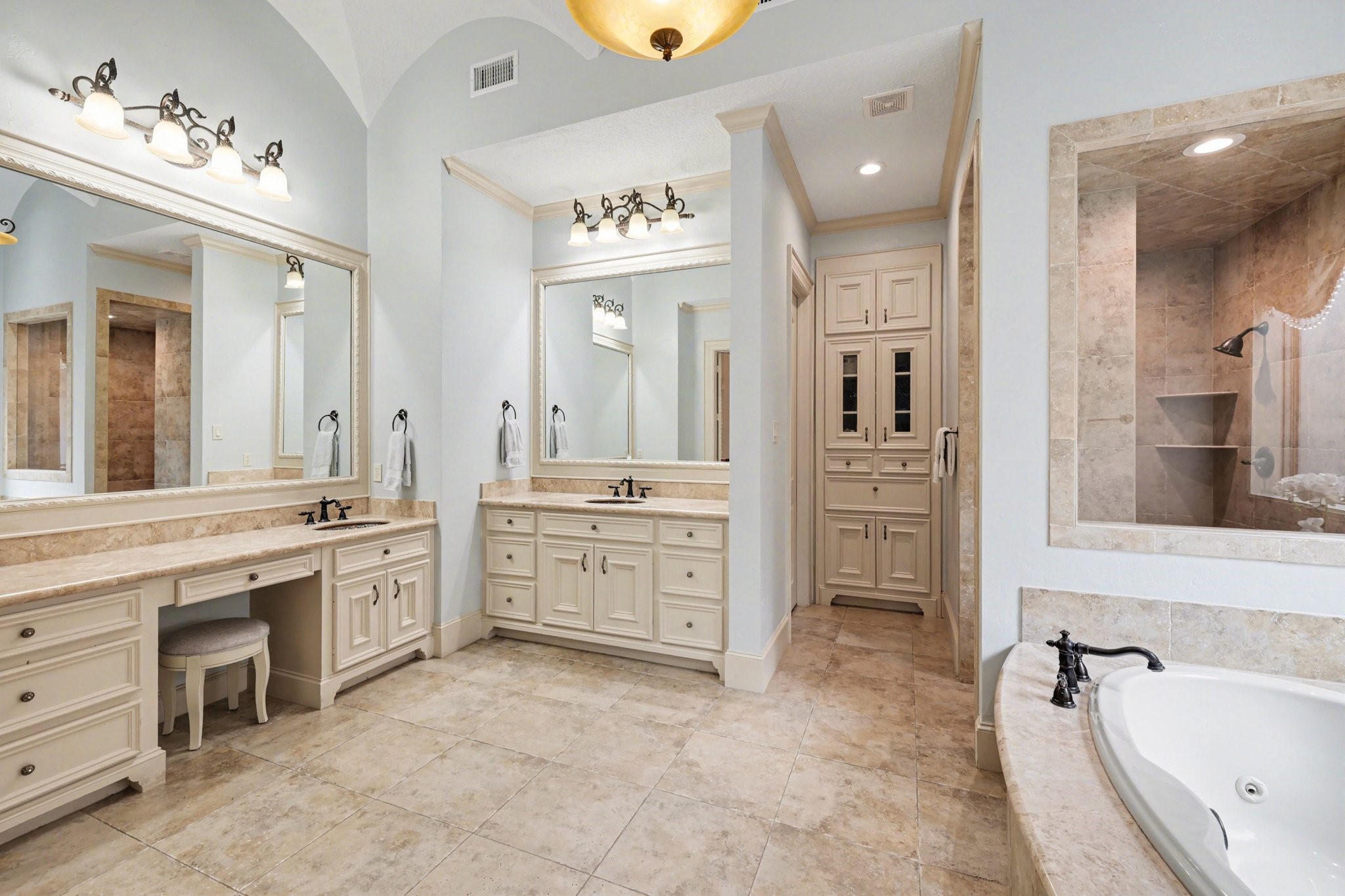 3 Player Ridge Court The Woodlands, TX 77382 - Photo 18 of 50 Spa-like primary bathroom with dual vanities, soaking tub, and oversized walk-in shower.