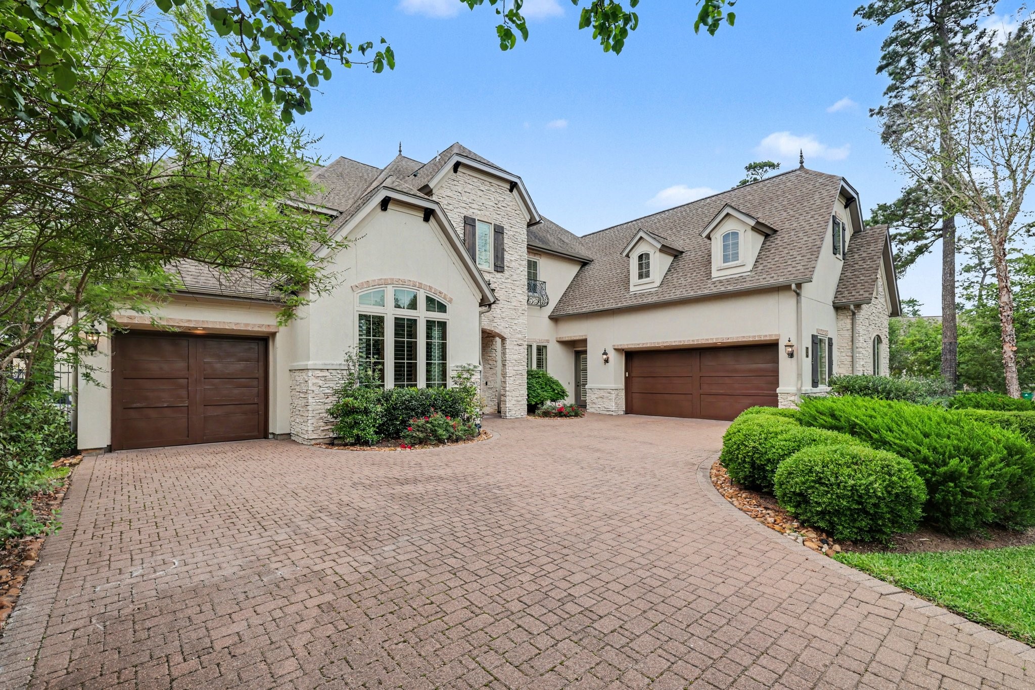 3 Player Ridge Court The Woodlands, TX 77382 - Photo 2 of 50 This extravagant home features a 3-car garage, 5 bedrooms, 5 full baths, 2 half baths, a wine cellar, a private home office, an upstairs theater and game room, an unforgettable backyard, and more!