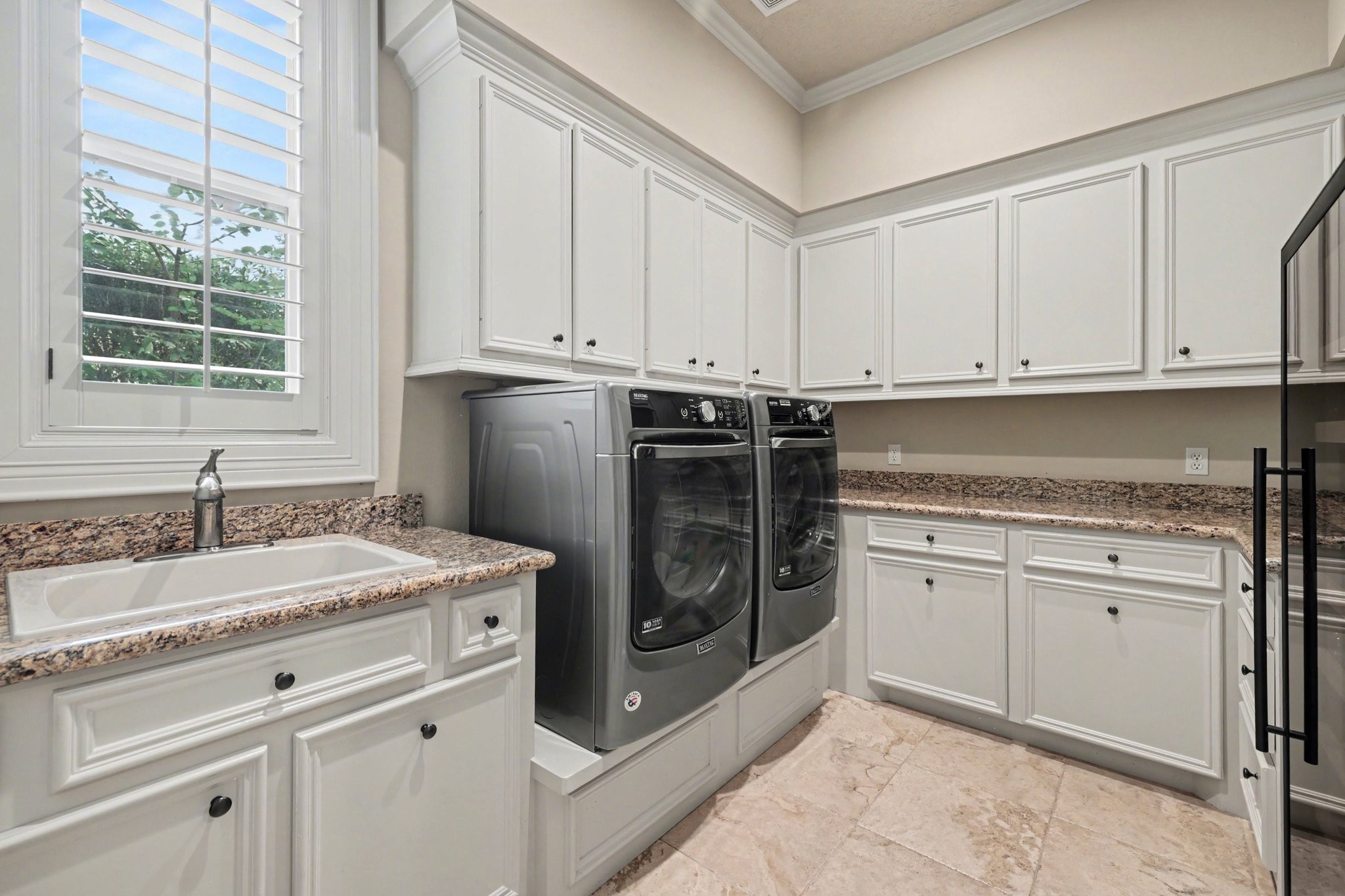 3 Player Ridge Court The Woodlands, TX 77382 - Photo 22 of 50 Oversized laundry room offering ample storage and an additional sink.
