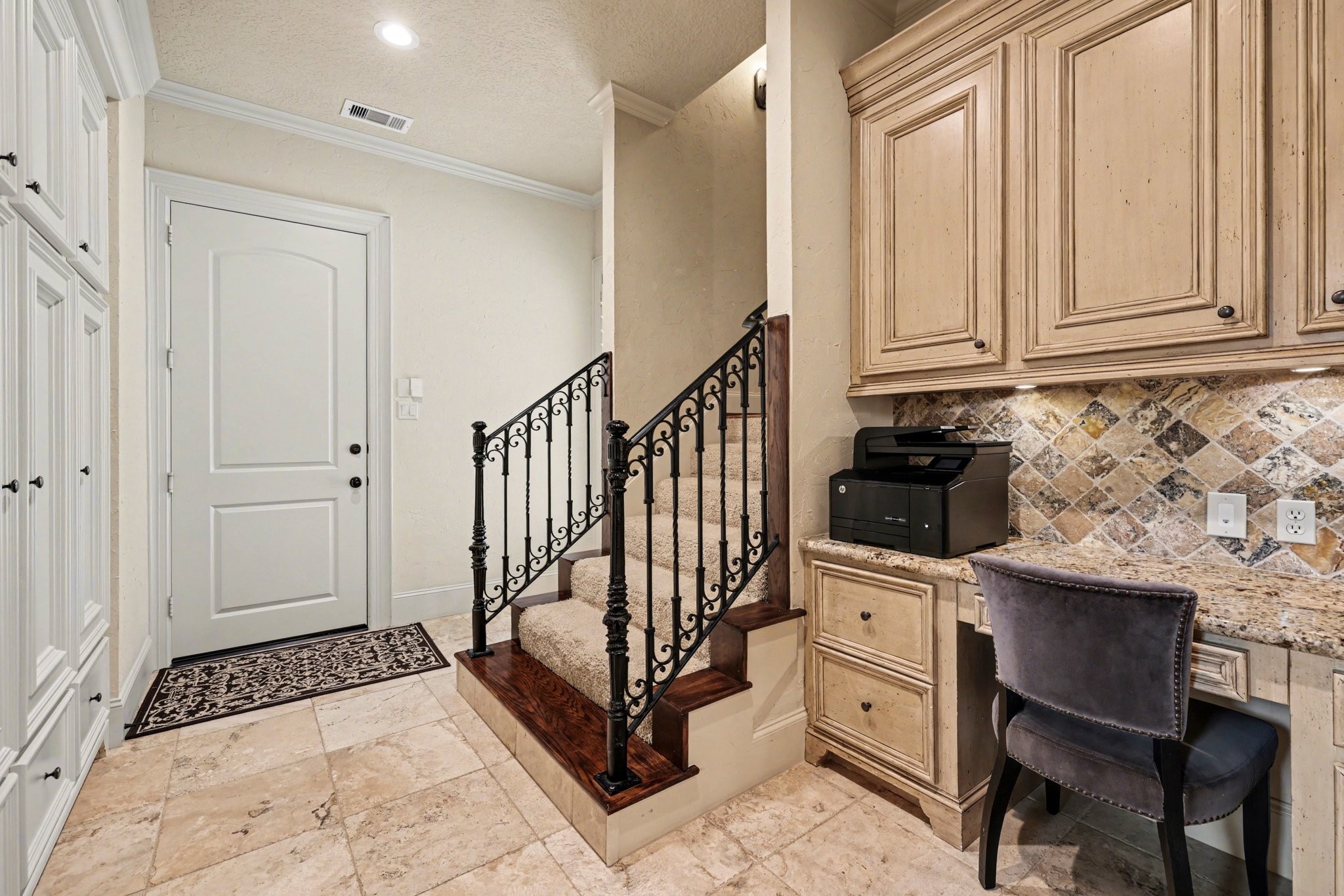 3 Player Ridge Court The Woodlands, TX 77382 - Photo 23 of 50 View of the secondary staircase with a built-in study nook and storage, offering convenient access to the laundry room and 2-car garage.