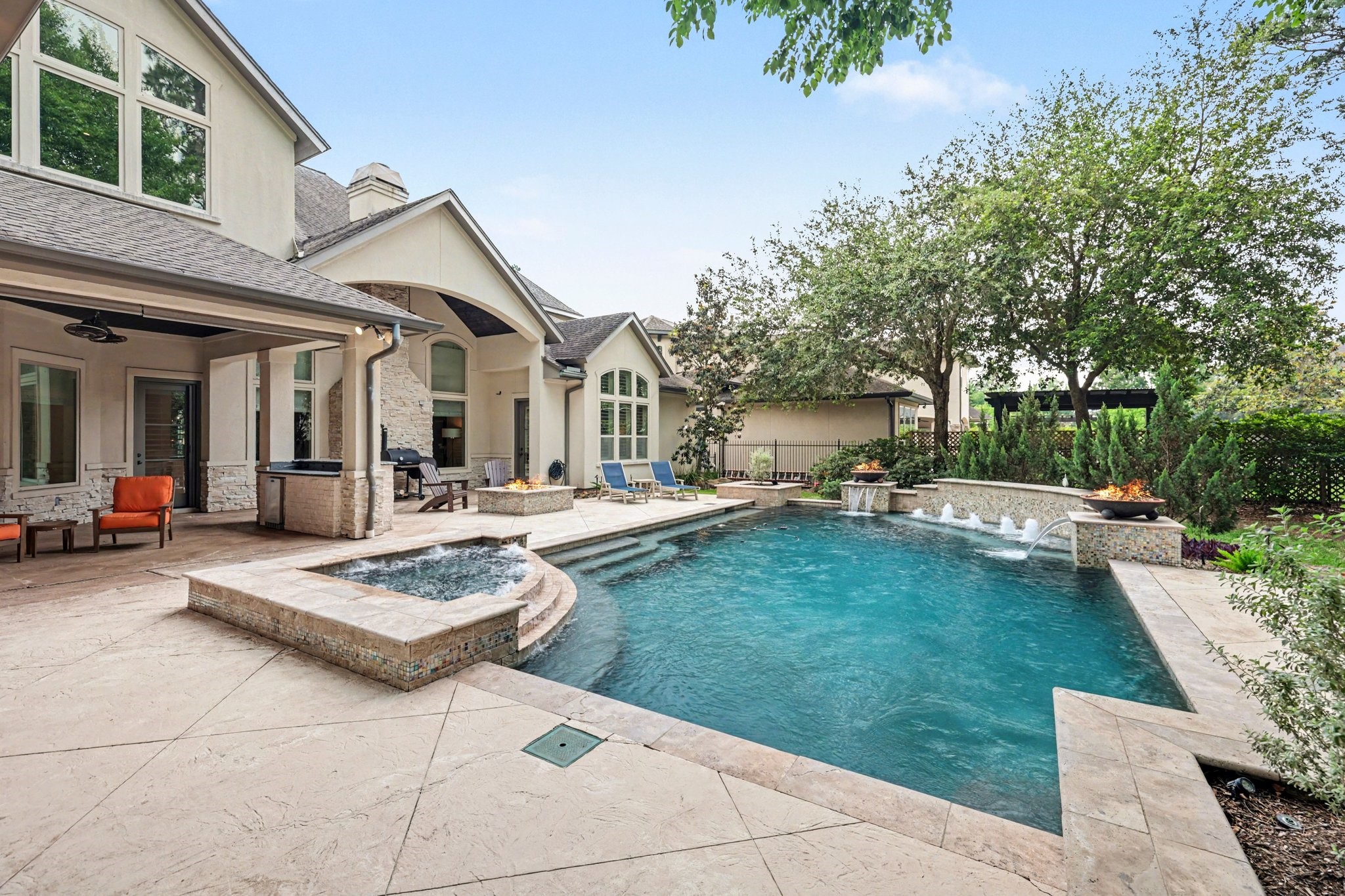 3 Player Ridge Court The Woodlands, TX 77382 - Photo 36 of 50 This backyard retreat features a sparkling pool and spa, serene water and fire features, and ample room to entertain!