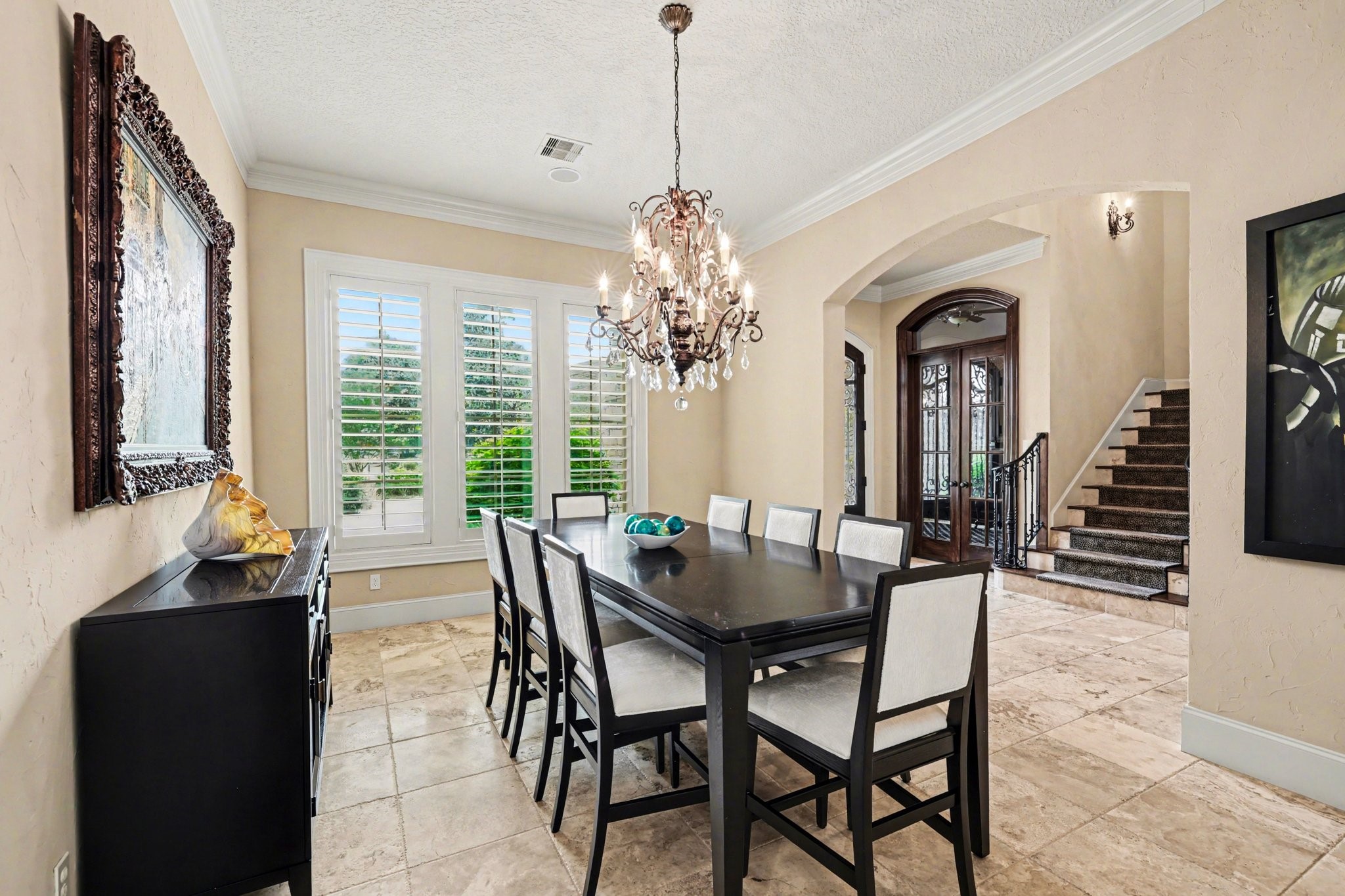 3 Player Ridge Court The Woodlands, TX 77382 - Photo 6 of 50 Elegant formal dining room with stunning chandelier, large windows, and abundant natural light.