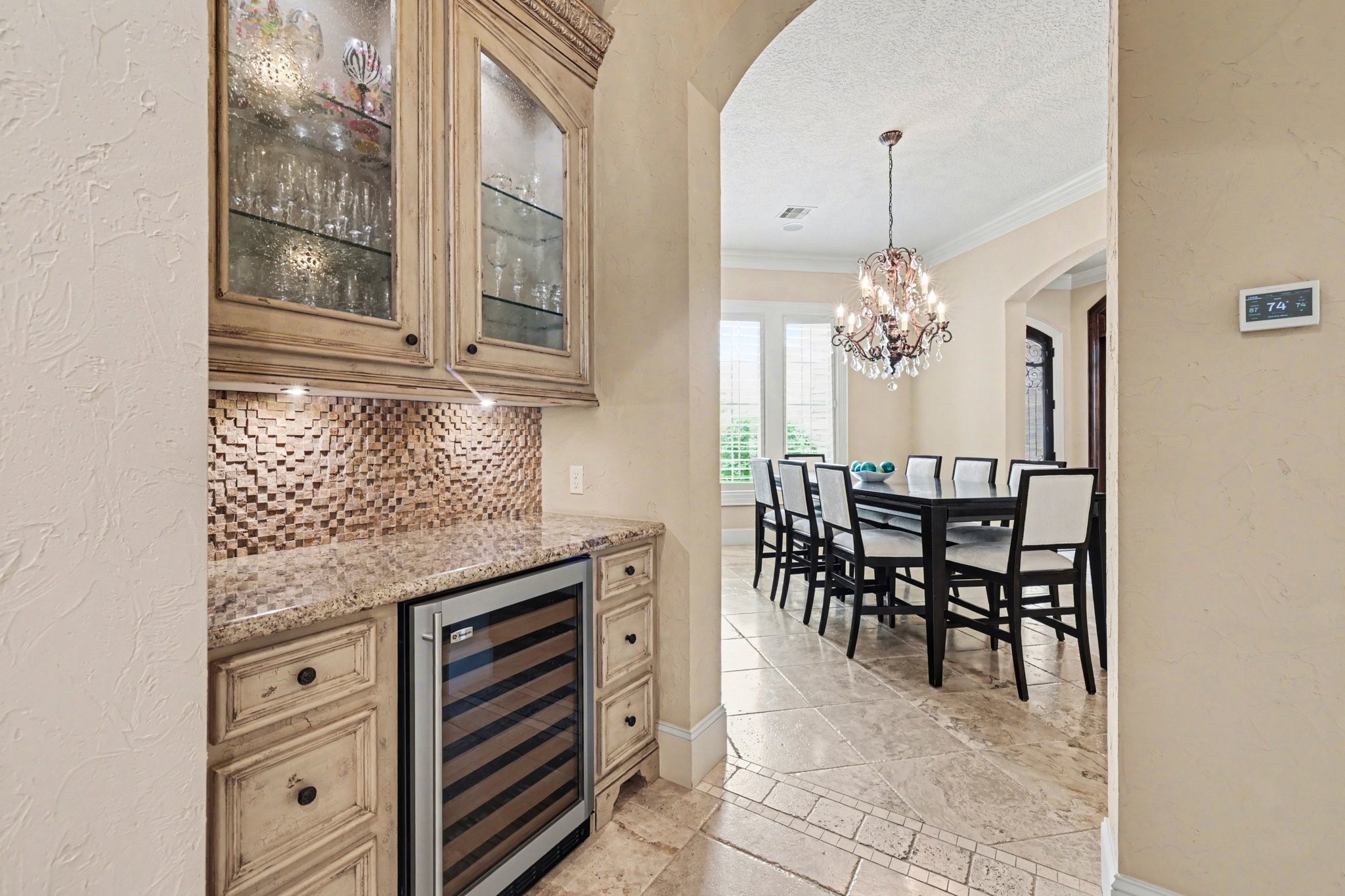 3 Player Ridge Court The Woodlands, TX 77382 - Photo 7 of 50 Charming butler’s pantry with custom cabinetry, wine fridge, and added storage space.