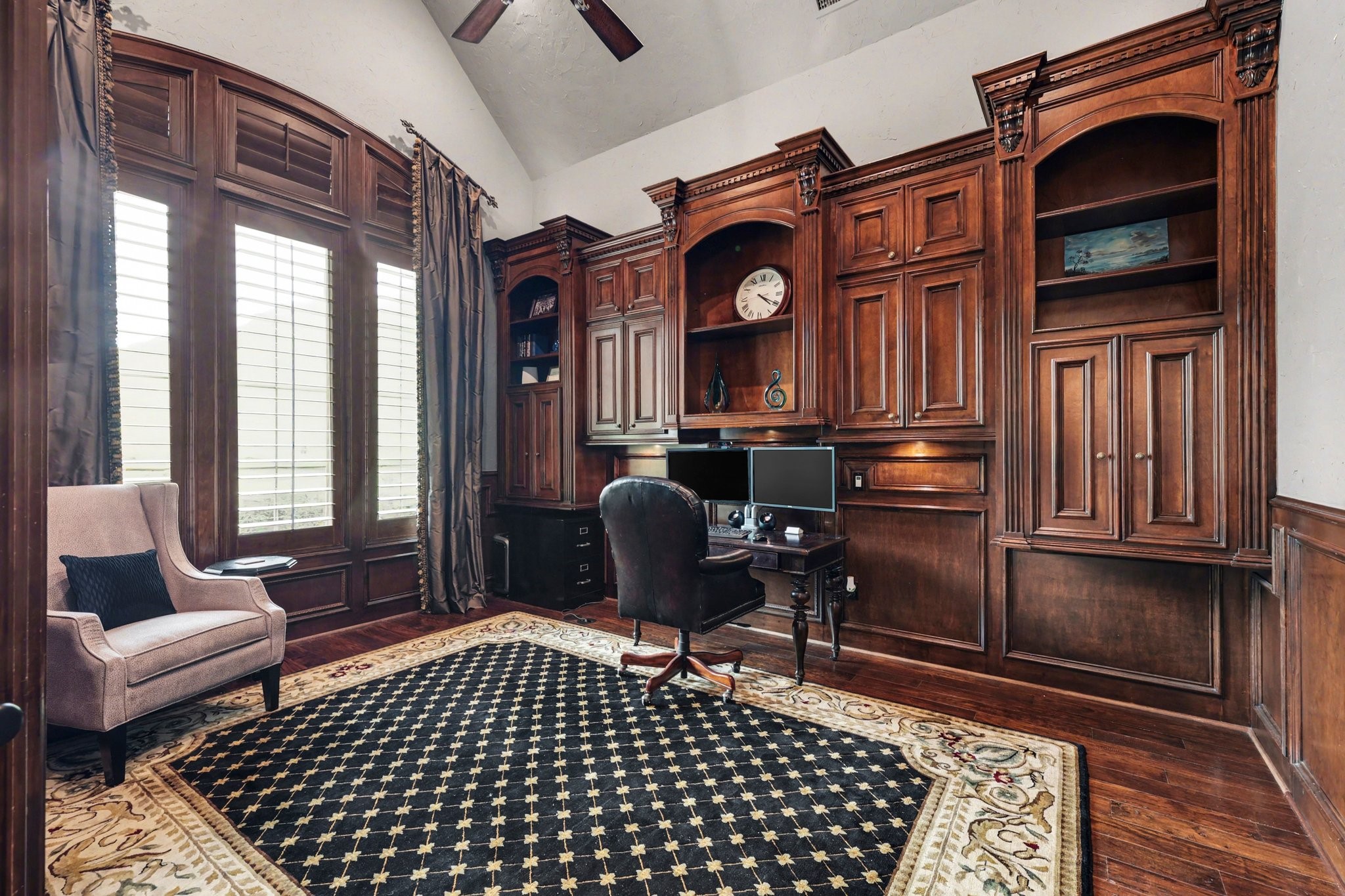 3 Player Ridge Court The Woodlands, TX 77382 - Photo 8 of 50 Sophisticated home office with custom built-ins, rich wood detailing, and soaring ceilings.