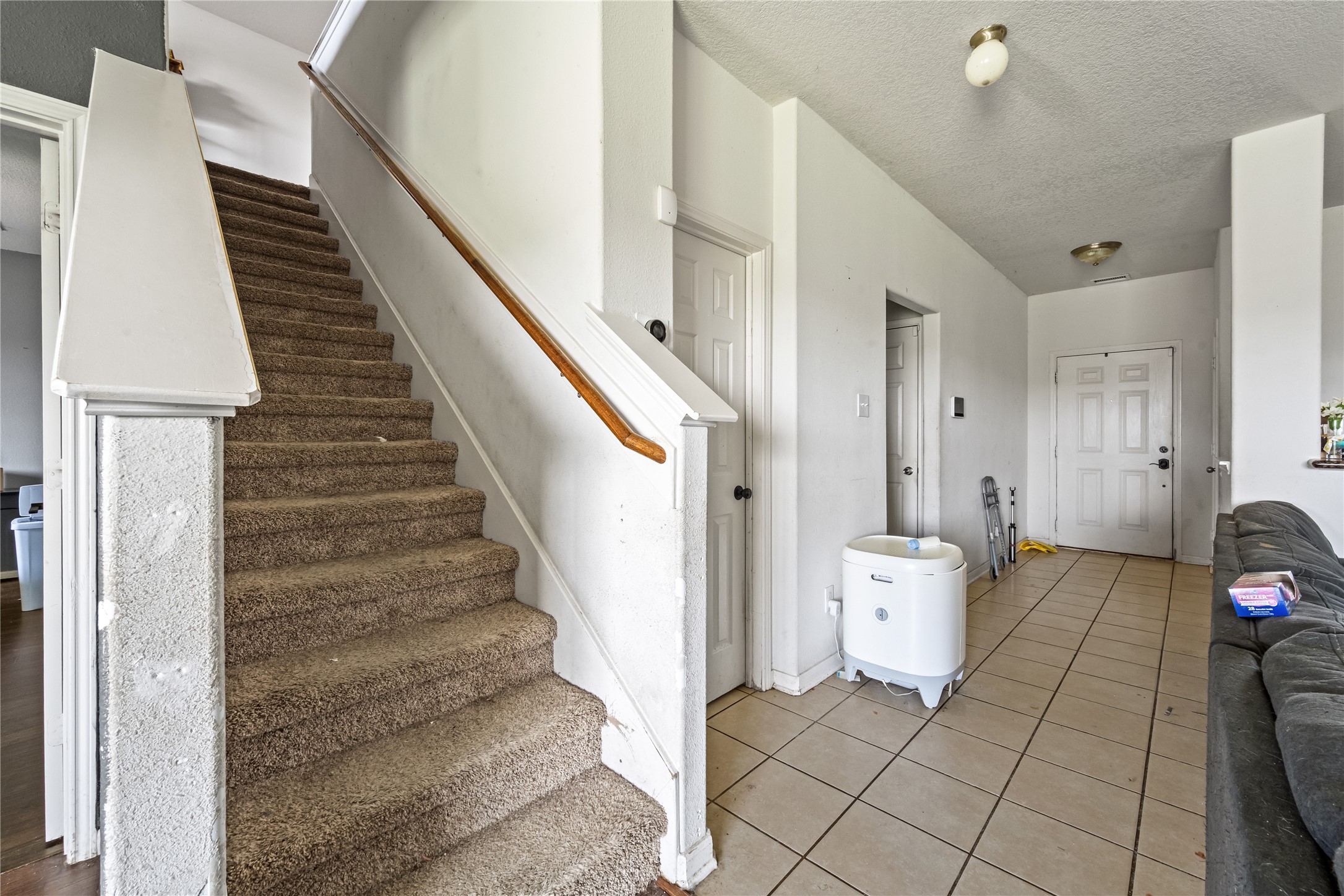 28832 San Bernard River Loop Spring, TX 77386 - Photo 5 of 50 a view of a hallway with wooden floor and staircase