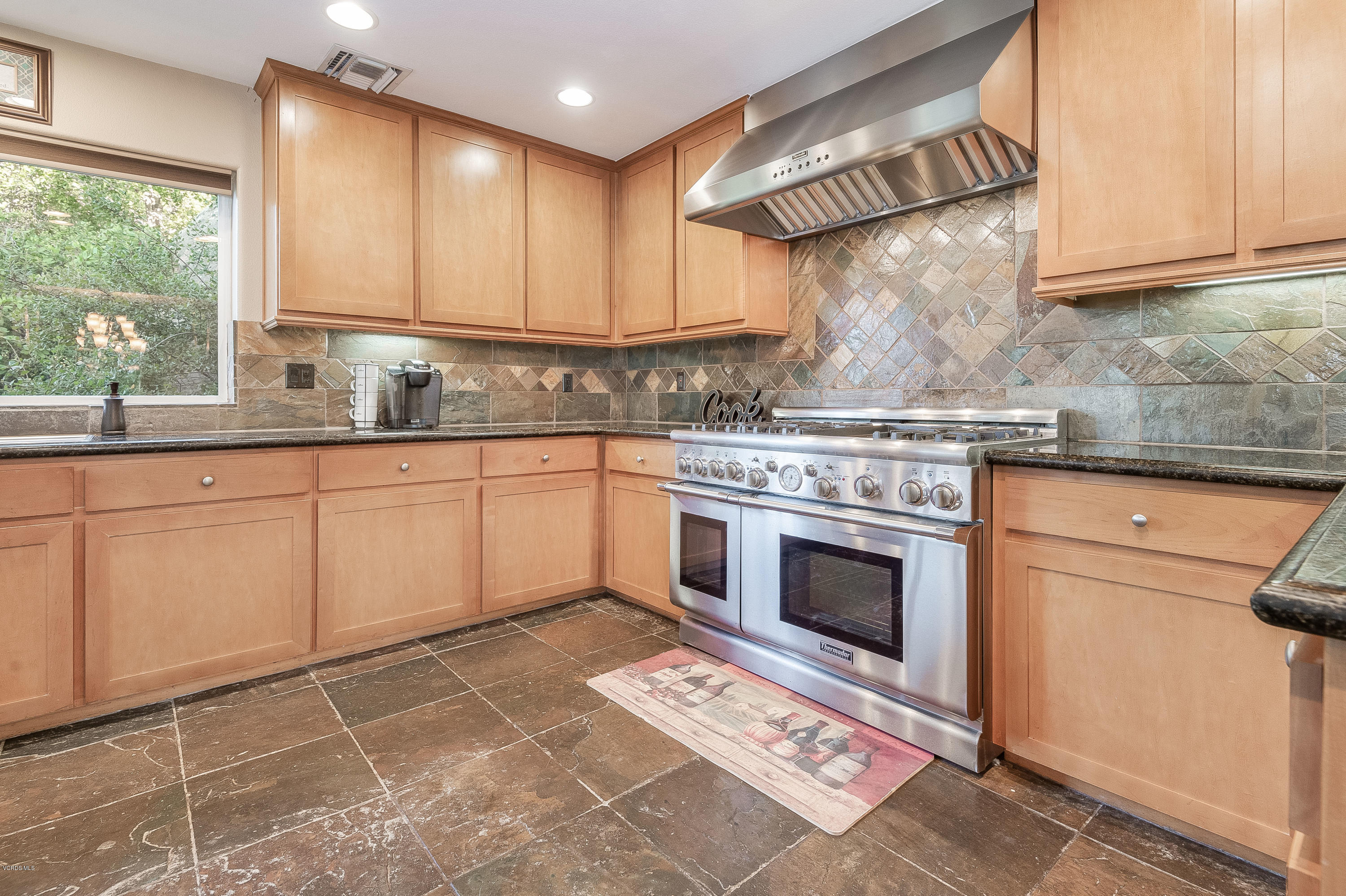 1079 Katherine Road Simi Valley, CA 93063 - Photo 12 of 53 a kitchen with cabinets a sink and appliances