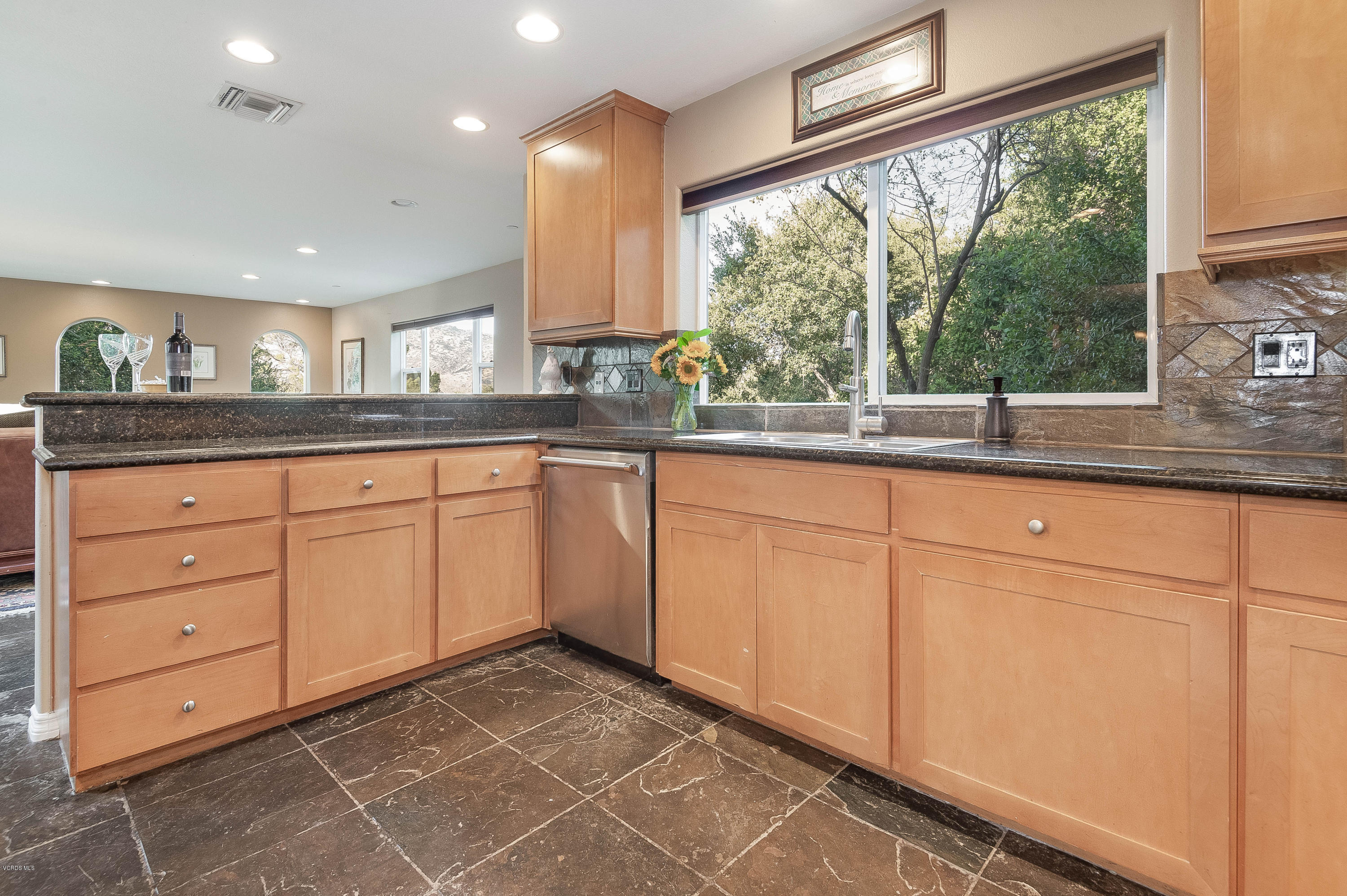 1079 Katherine Road Simi Valley, CA 93063 - Photo 13 of 53 a kitchen with granite countertop white cabinets and a large window