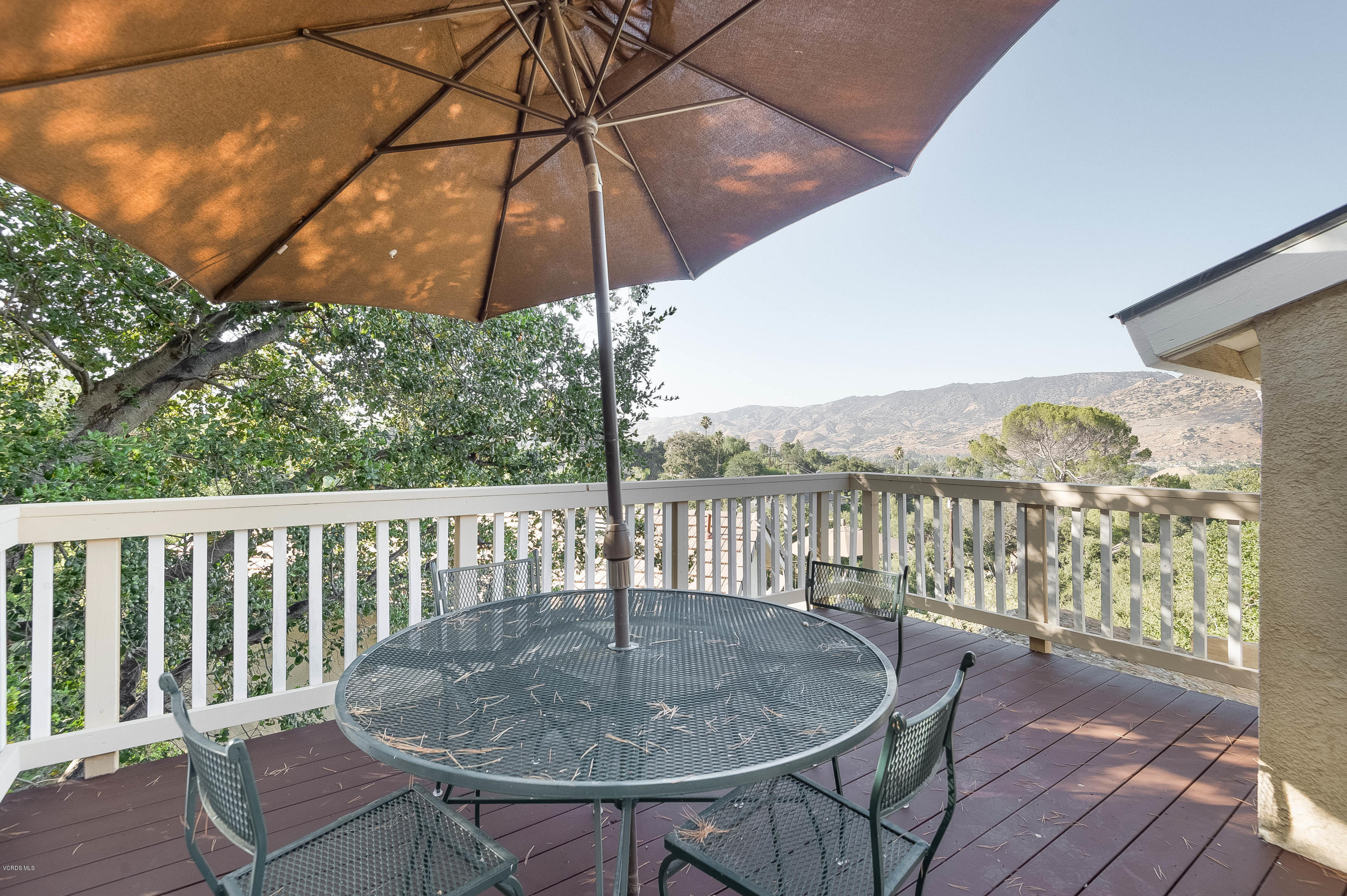 1079 Katherine Road Simi Valley, CA 93063 - Photo 24 of 53 a view of a balcony with furniture and wooden floor