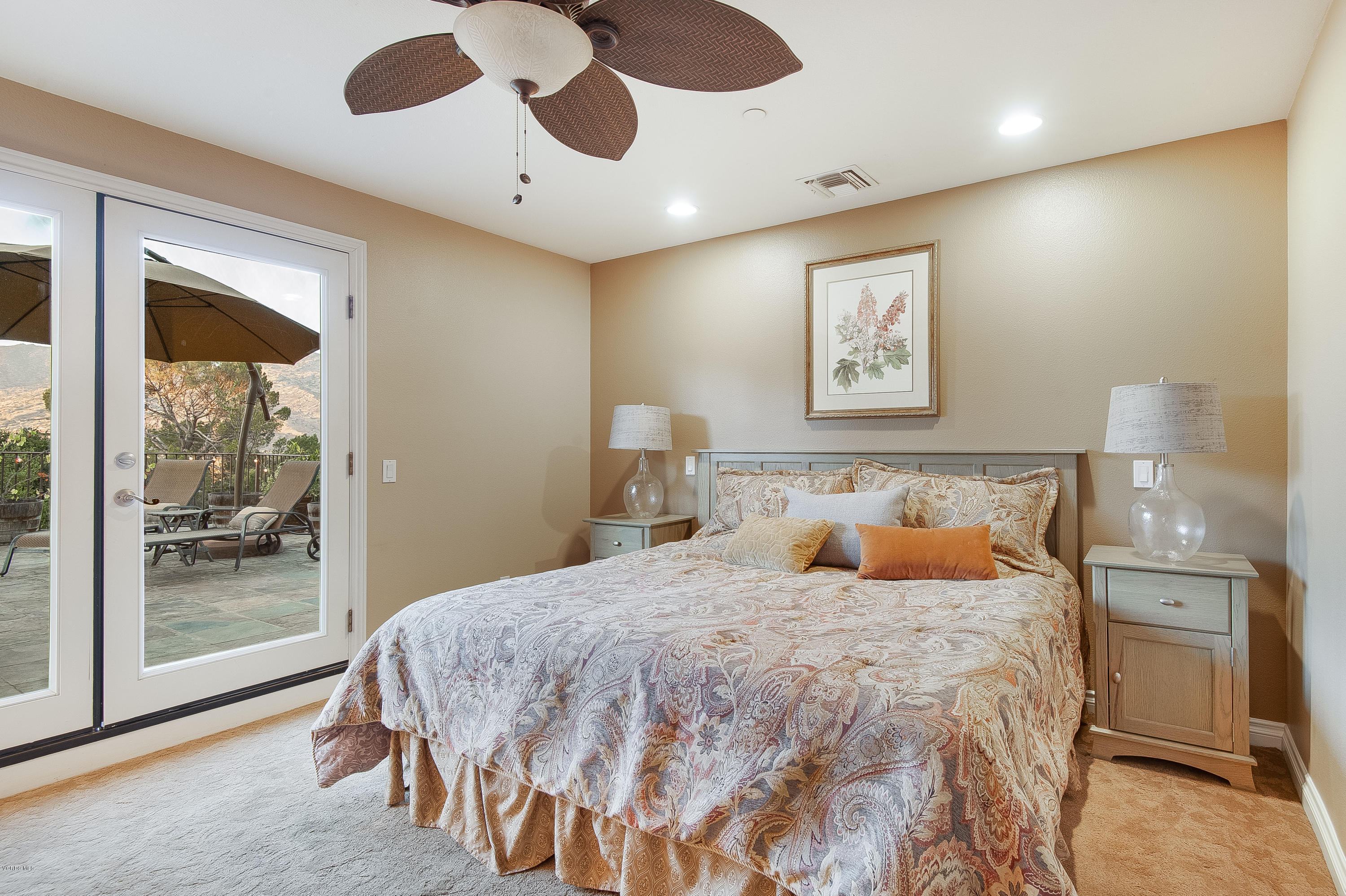 1079 Katherine Road Simi Valley, CA 93063 - Photo 25 of 53 a bedroom with a large bed and a chandelier