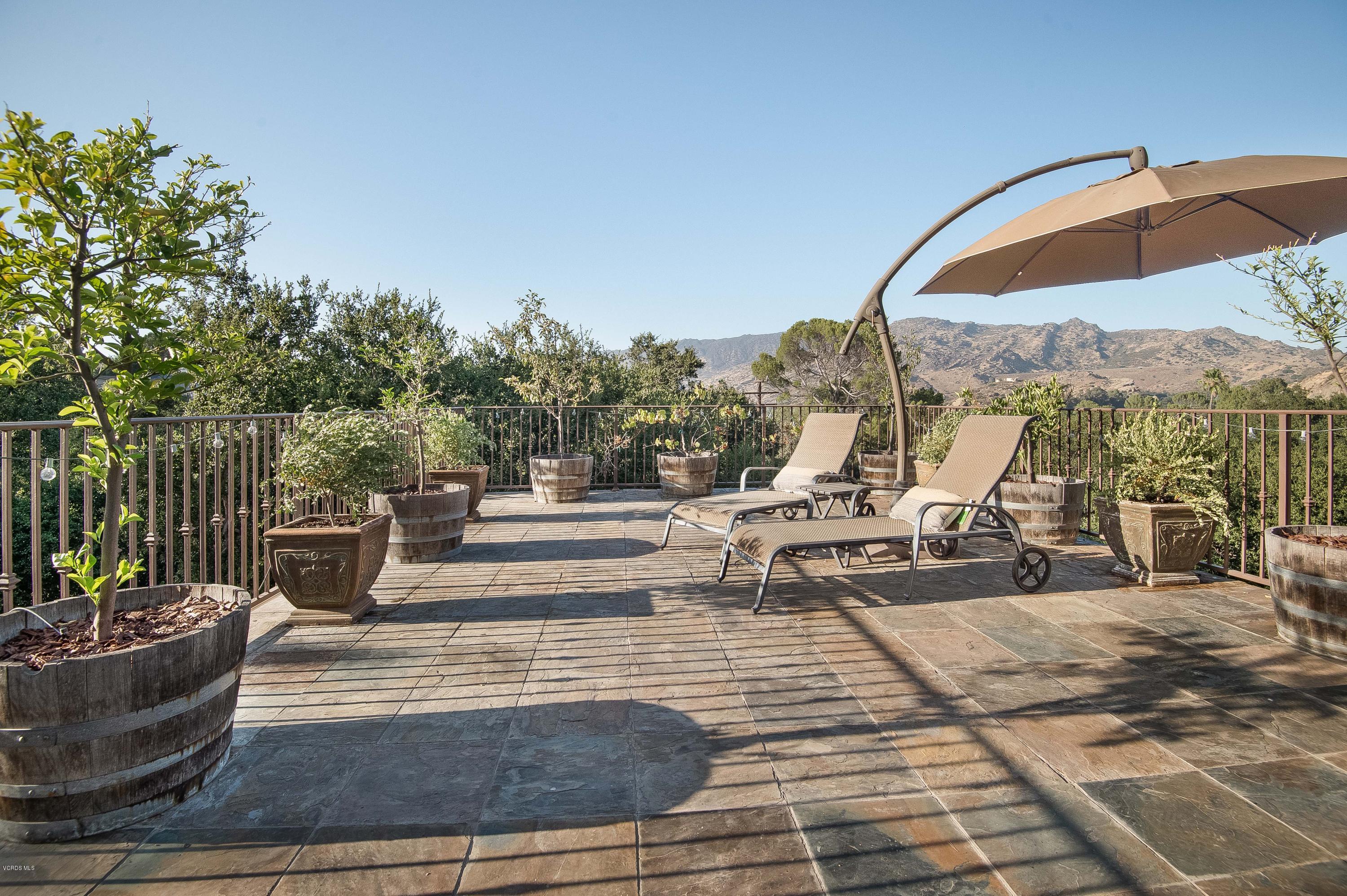 1079 Katherine Road Simi Valley, CA 93063 - Photo 31 of 53 a view of swimming pool with seating space and trees in the background