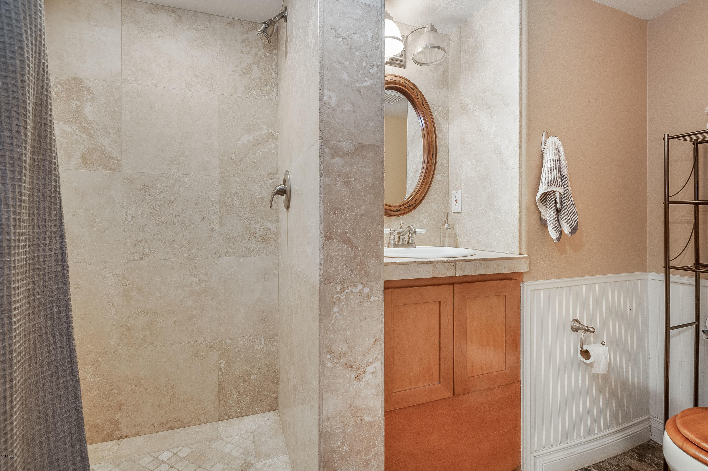 1079 Katherine Road Simi Valley, CA 93063 - Photo 37 of 53 a bathroom with a mirror and a shower