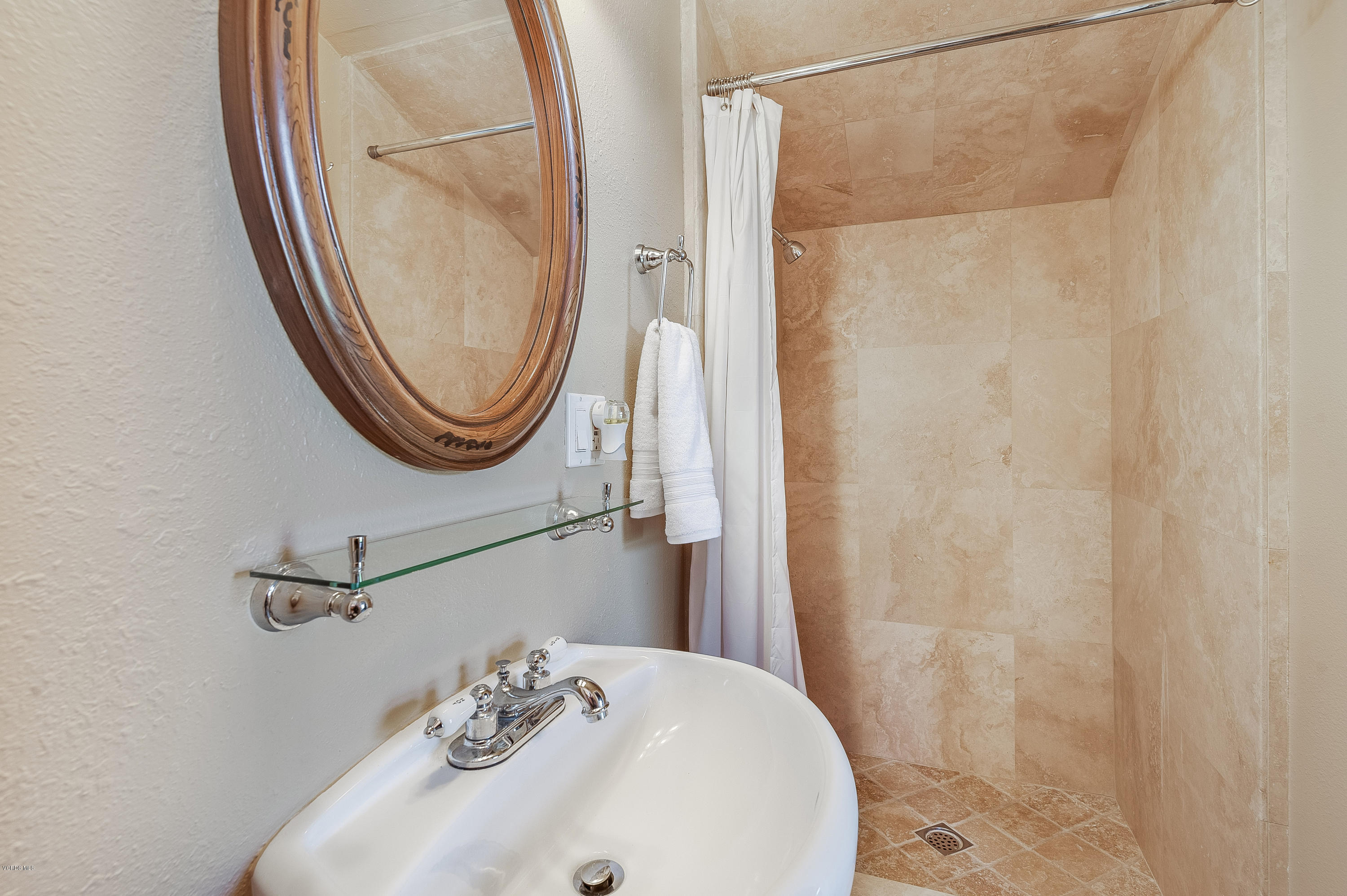 1079 Katherine Road Simi Valley, CA 93063 - Photo 38 of 53 a bathroom with a sink and a mirror