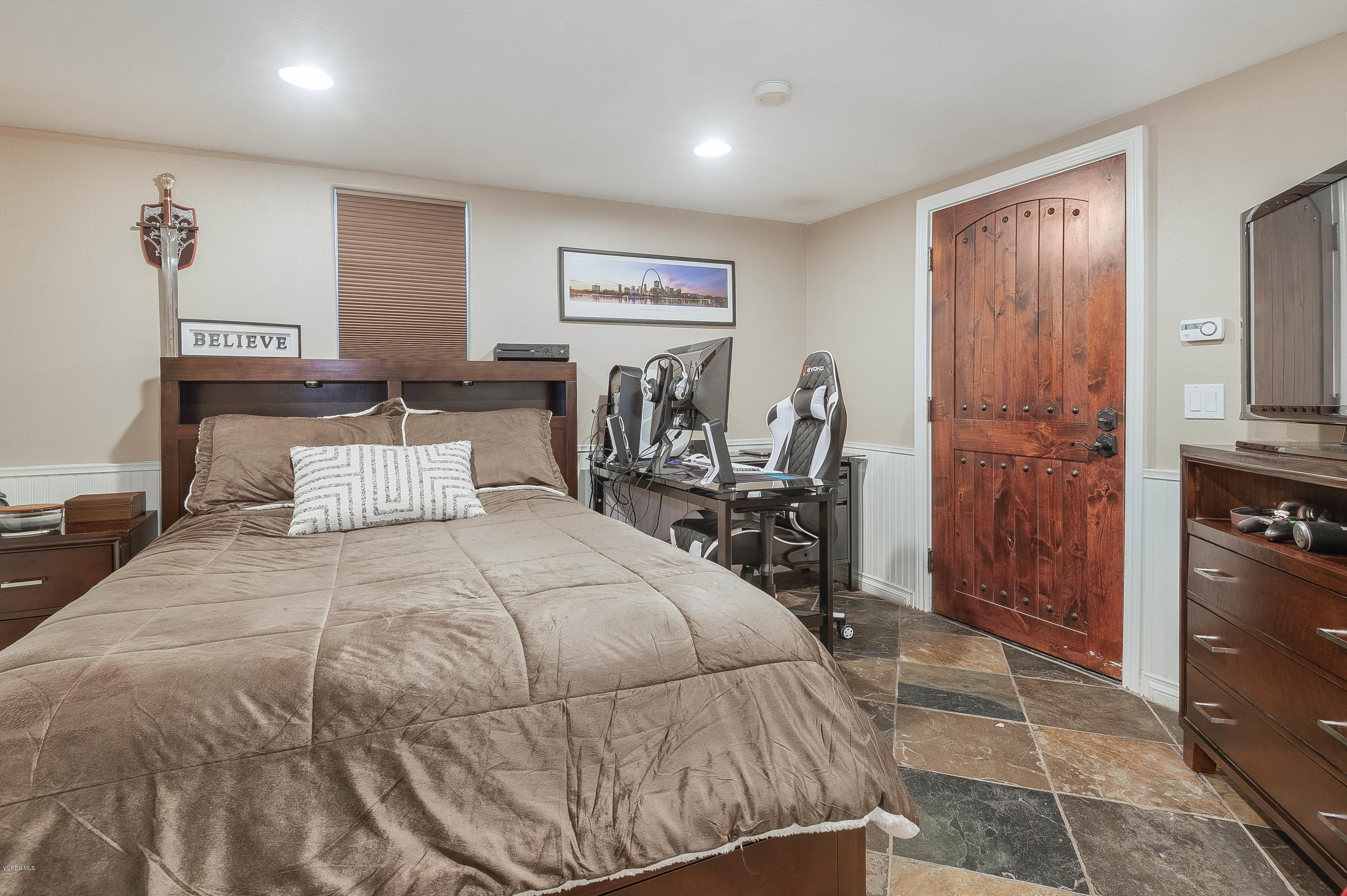 1079 Katherine Road Simi Valley, CA 93063 - Photo 39 of 53 a bedroom with a bed and a table