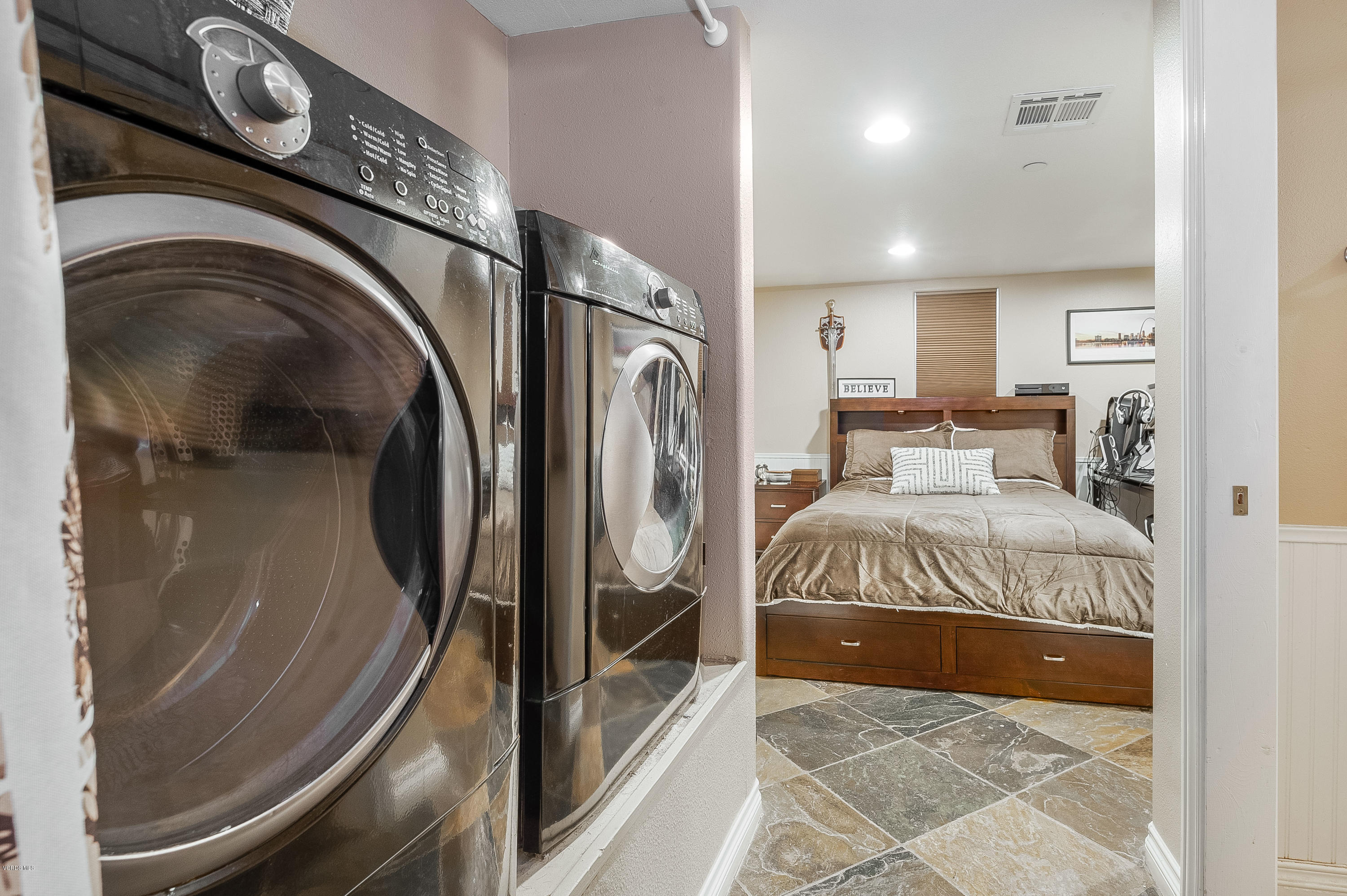 1079 Katherine Road Simi Valley, CA 93063 - Photo 40 of 53 a bedroom with a bed and a mirror