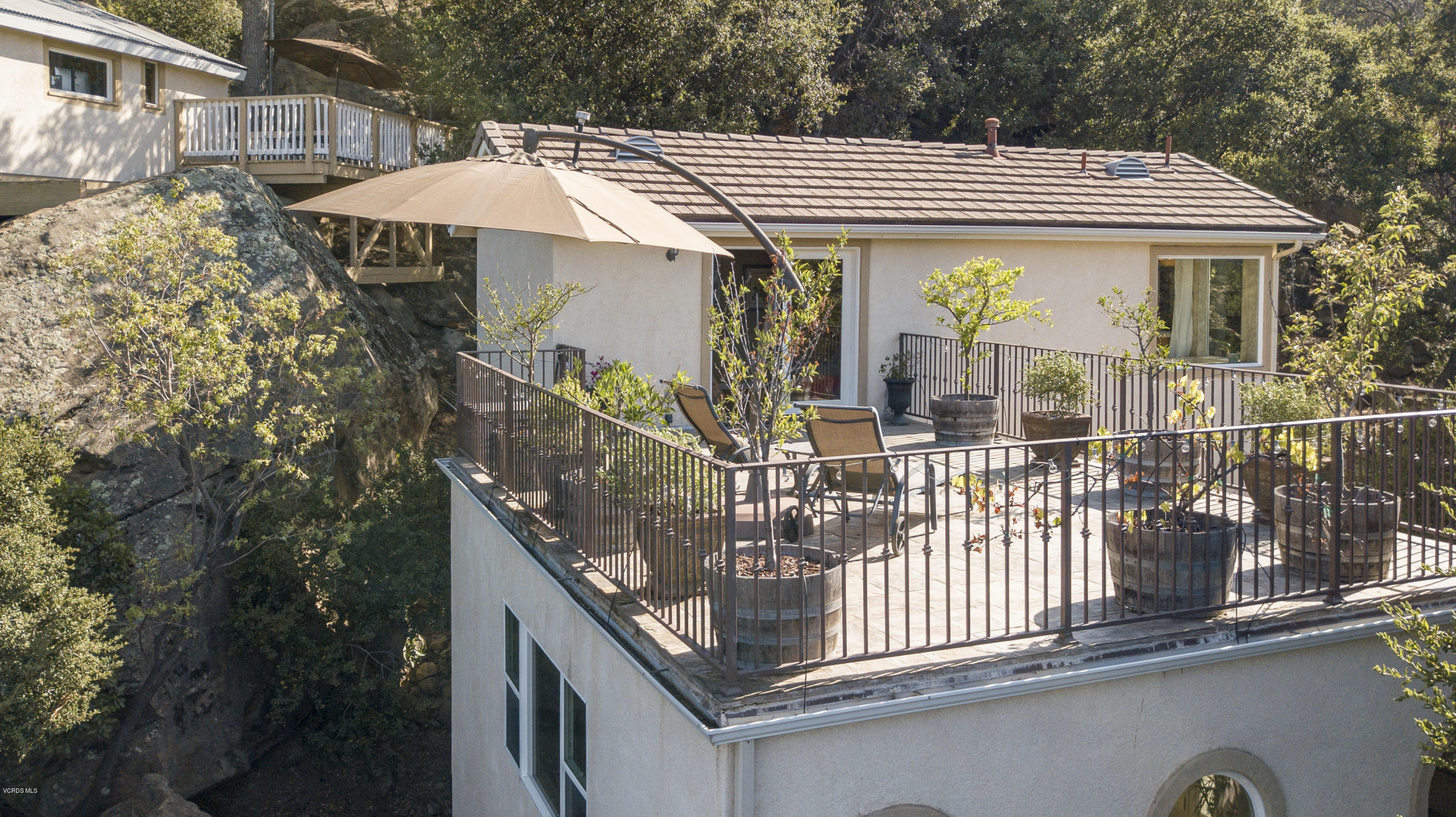 1079 Katherine Road Simi Valley, CA 93063 - Photo 53 of 53 a view of a house with balcony and wooden fence