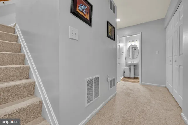 a view of a hallway with staircase