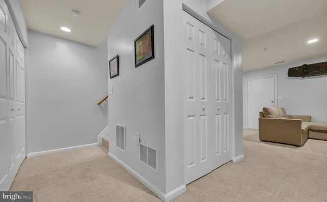 a view of room with stairs and windows