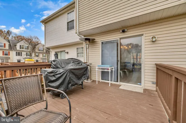 a view of a chairs and table in patio