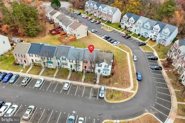 a picture of a bench in front of a building
