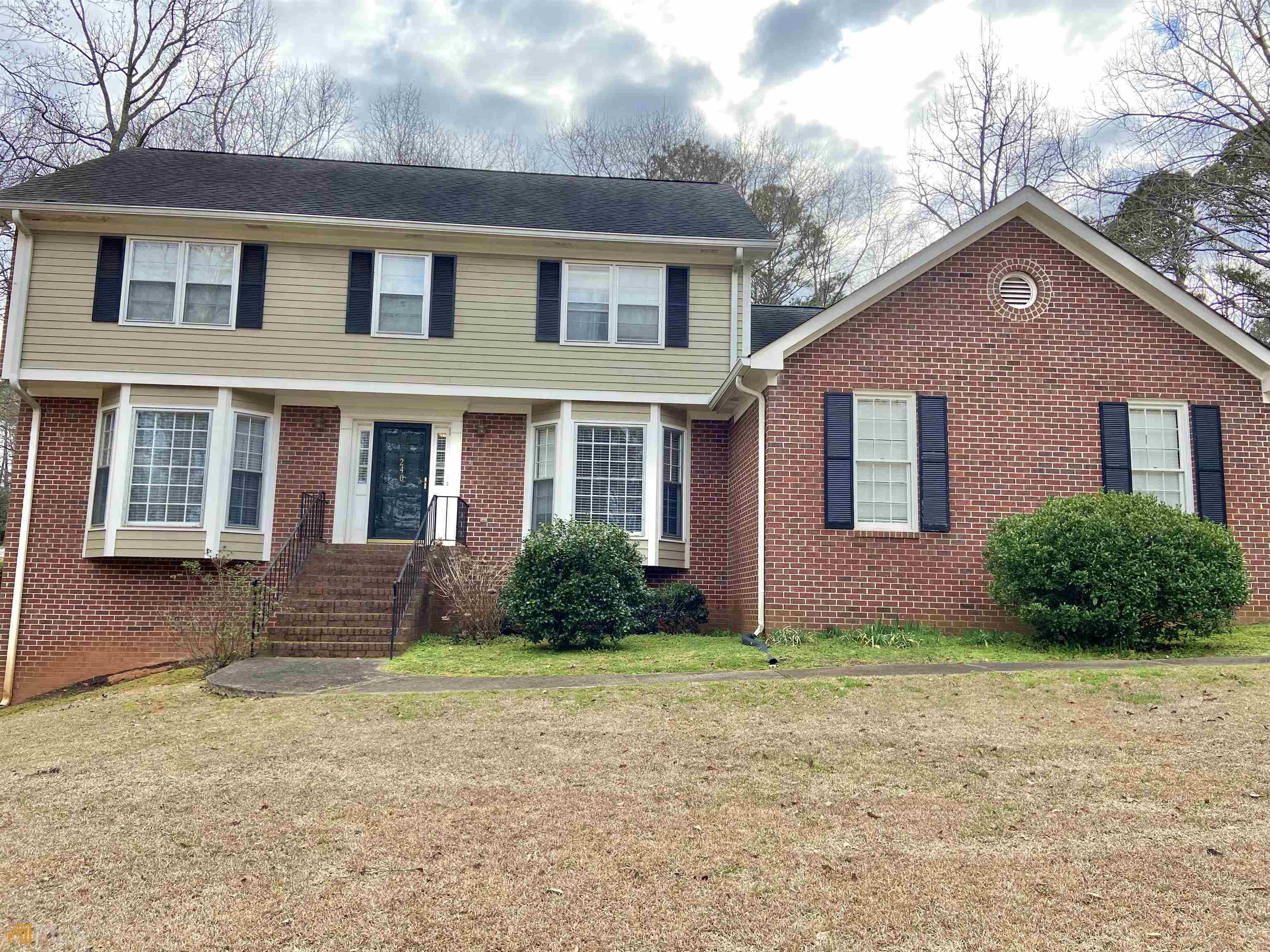 240 West Huntington Road Bogart, GA 30622 - Photo 1 of 1 a front view of a house with garden