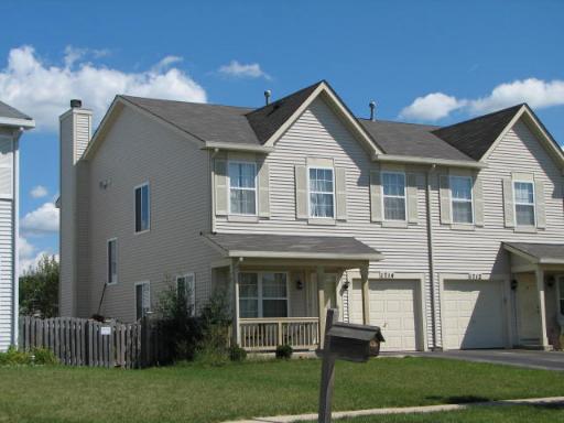 1714 Raleigh Trail Romeoville, IL 60446 - Photo 1 of 1 a front view of house with a garden