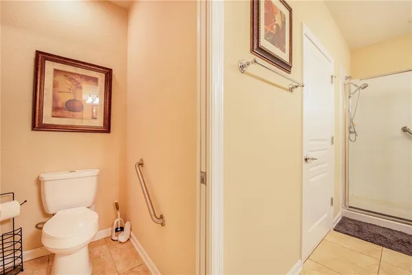 a bathroom with a double vanity sink mirror and shower