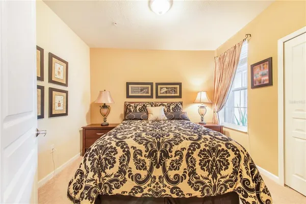a bedroom with a bed and a book shelf