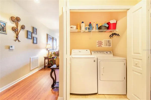 a living room with furniture and a large window with garden view