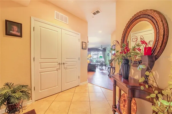 a view of a living room with a table and chair