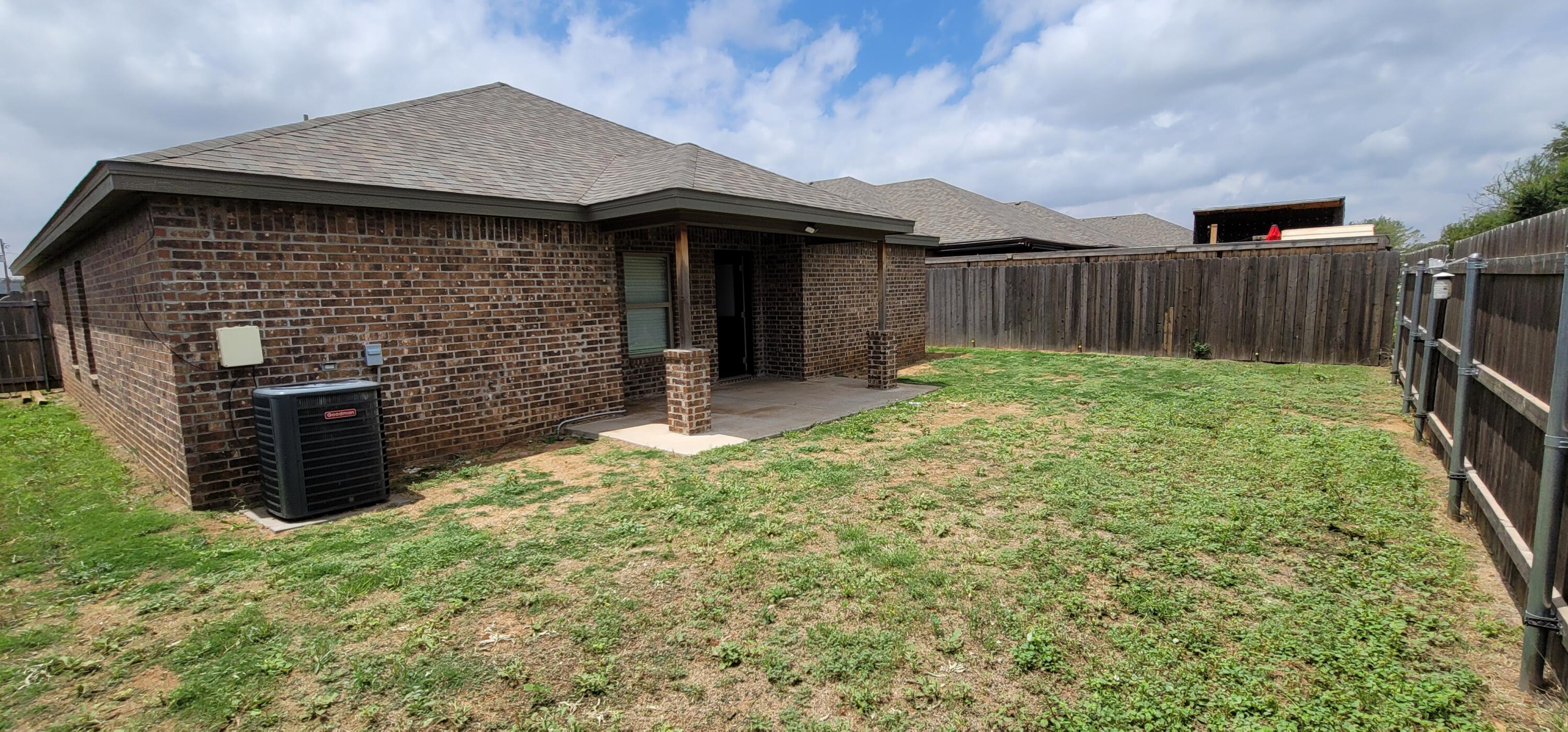 2110 88th Street Lubbock, TX 79423 - Photo 22 of 22 a backyard of a house with barbeque oven