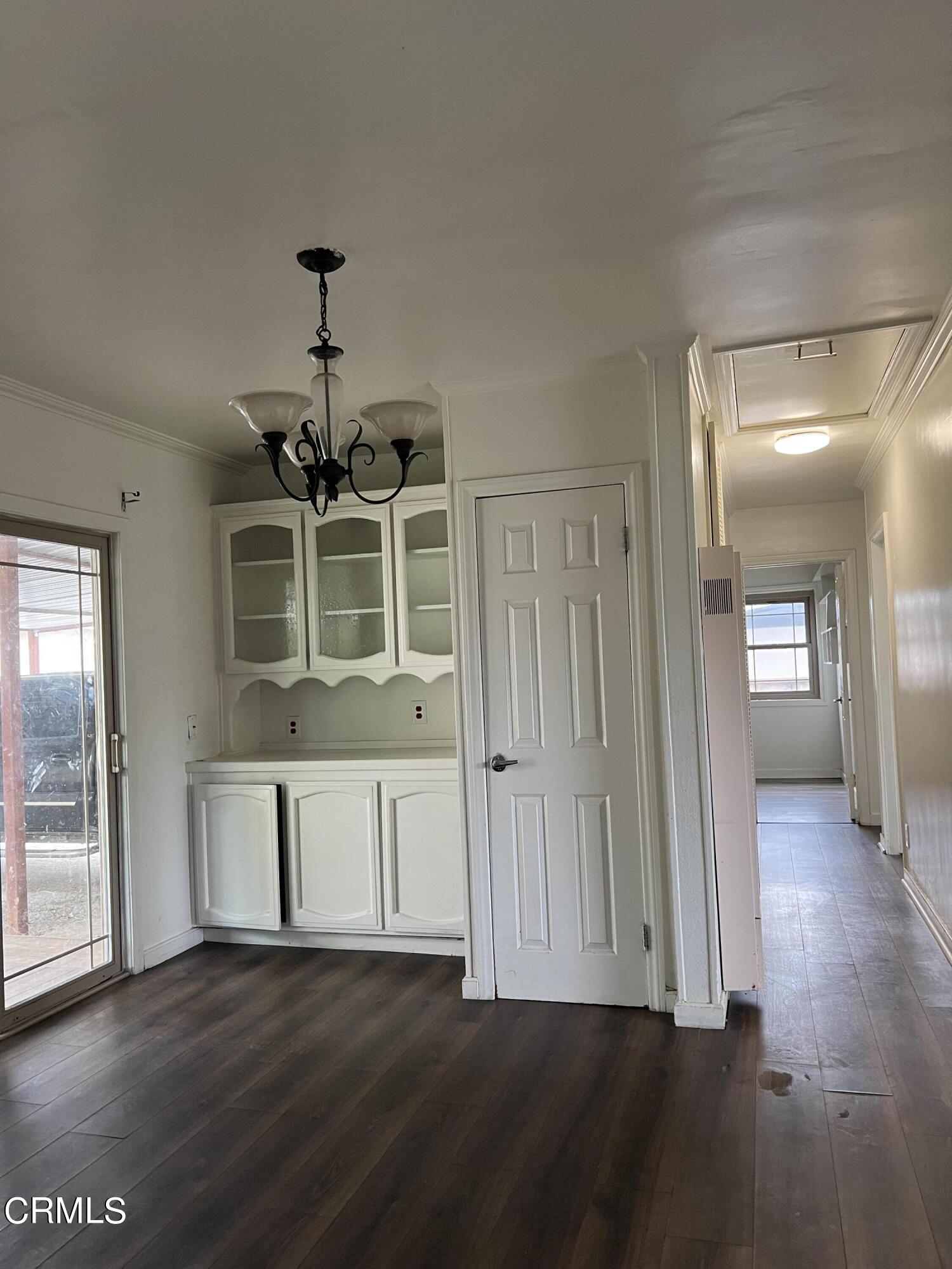 4840 Saviers Road Oxnard, CA 93033 - Photo 11 of 24 wooden floor in an empty room with a window