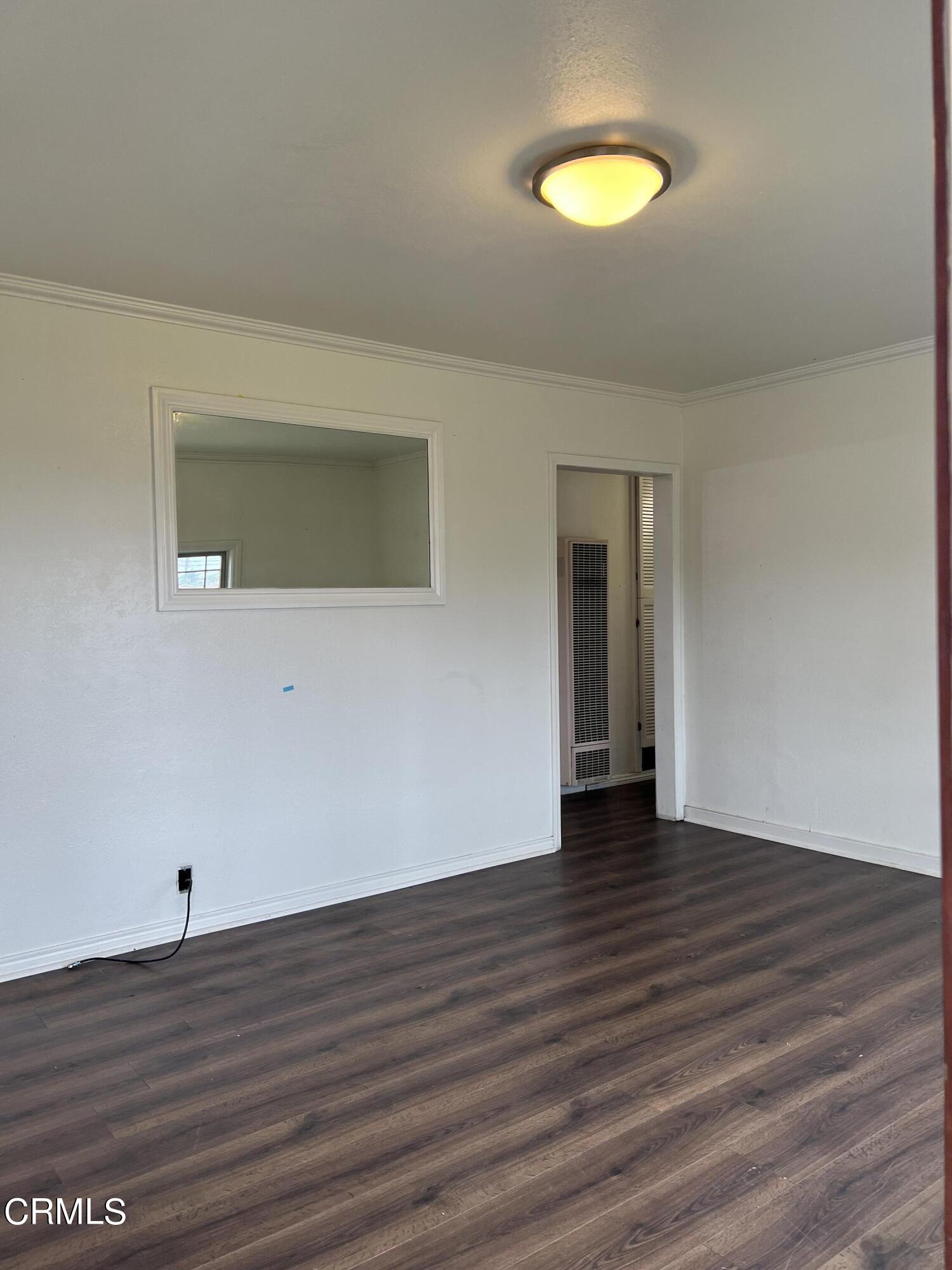 4840 Saviers Road Oxnard, CA 93033 - Photo 12 of 24 a view of a room with wooden floor and window
