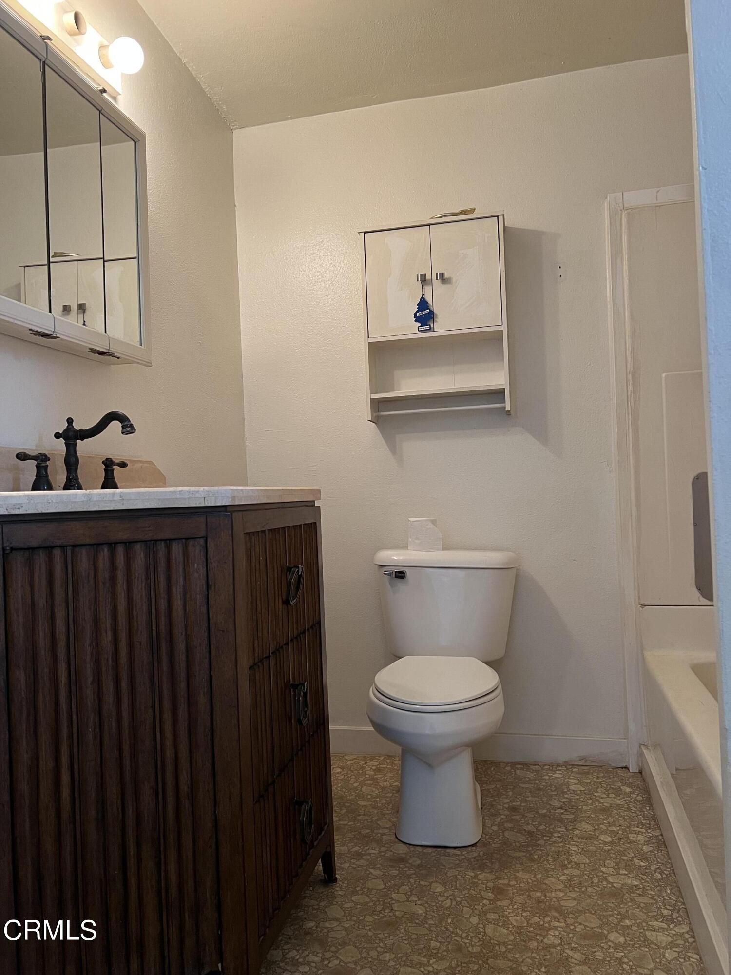 4840 Saviers Road Oxnard, CA 93033 - Photo 15 of 24 a bathroom with a sink a toilet and mirror